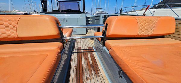 2019 Sunreef 40 Open yacht with orange seating and wooden deck.