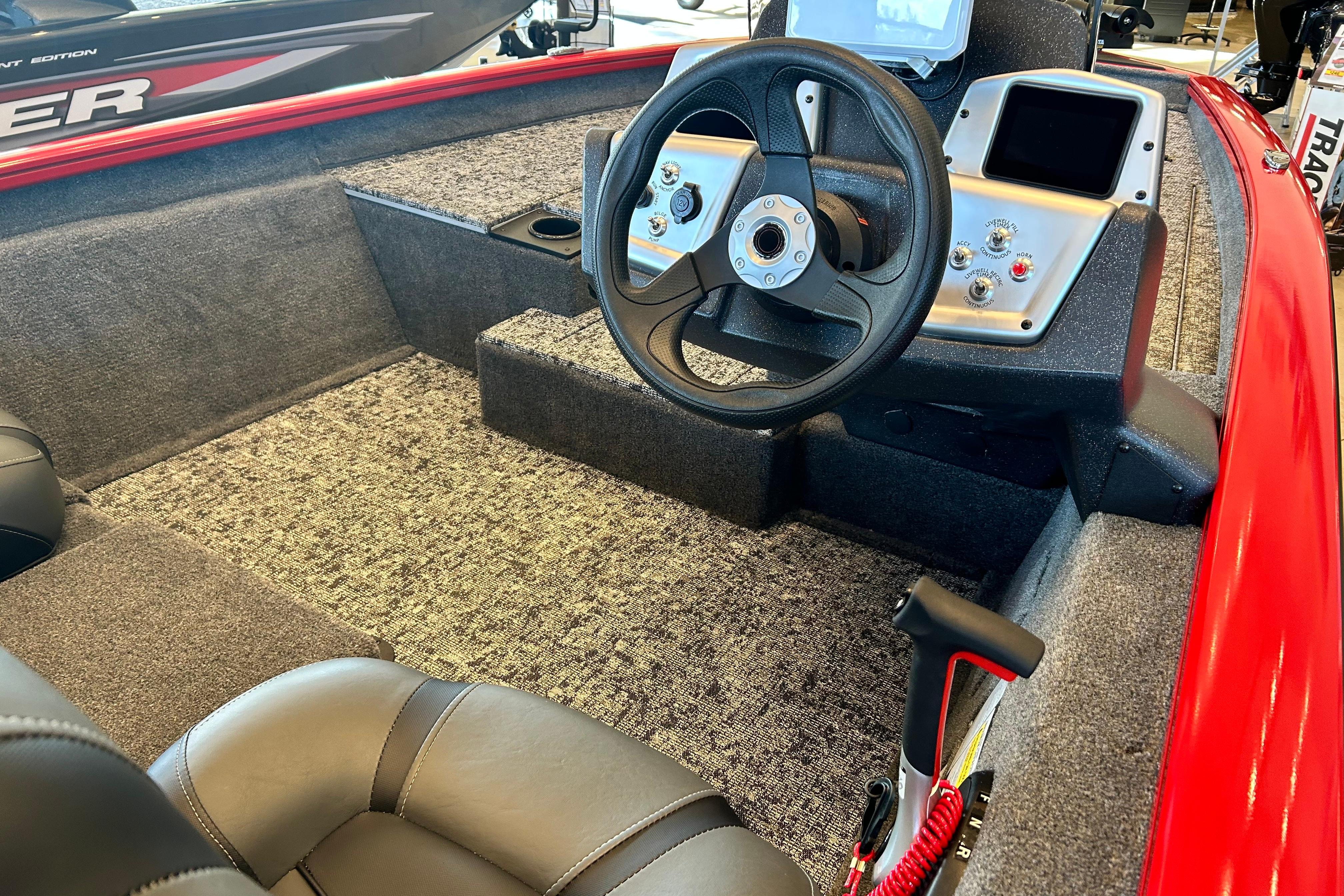 Interior of 2026 Tracker Pro Team 175 boat with steering wheel and controls.