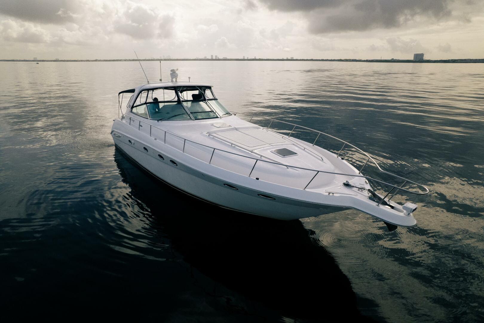 2003 Sea Ray Sundancer 460 yacht on calm waters under cloudy skies.