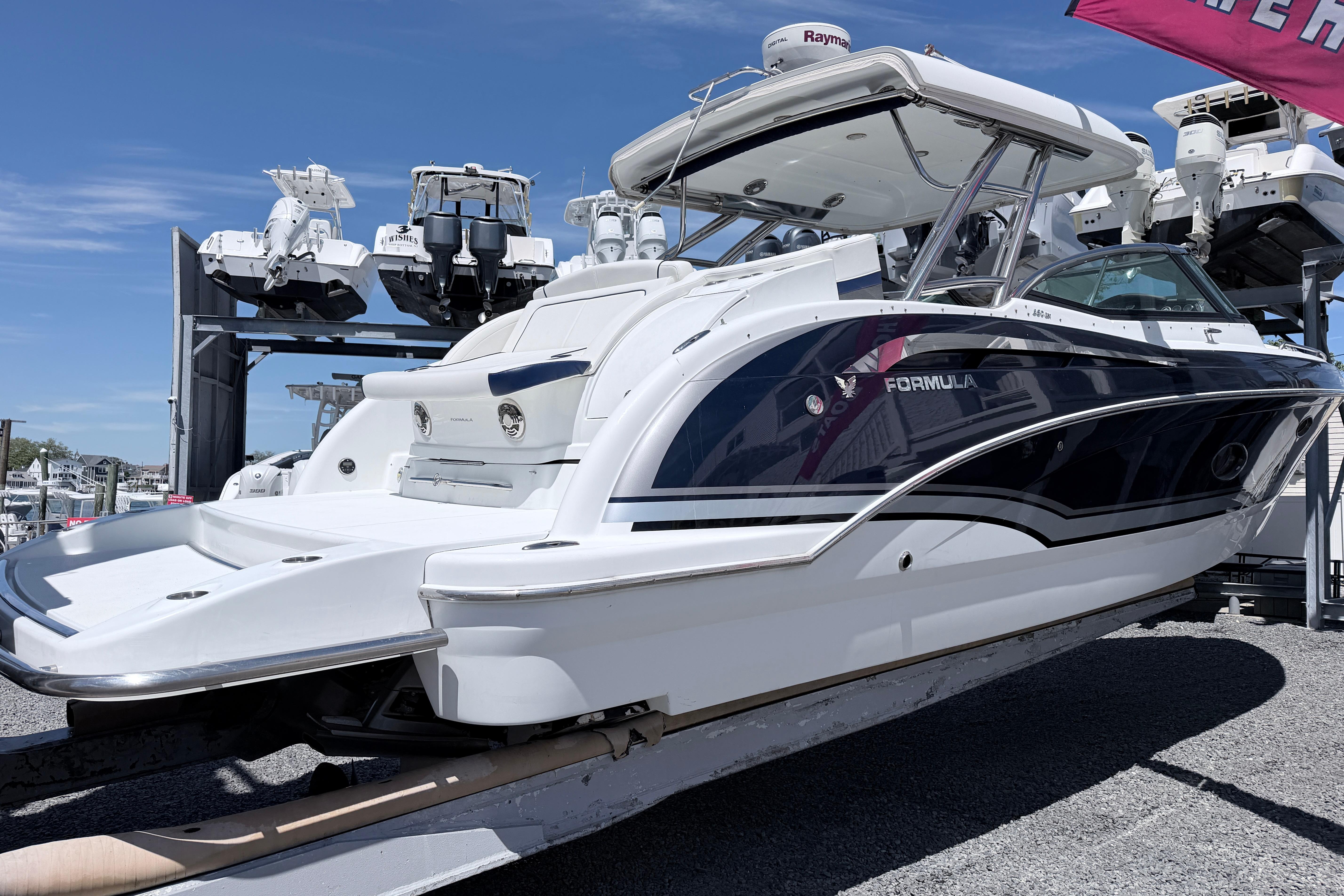 2015 Formula 350 Crossover Bowrider boat displayed outdoors on a sunny day.