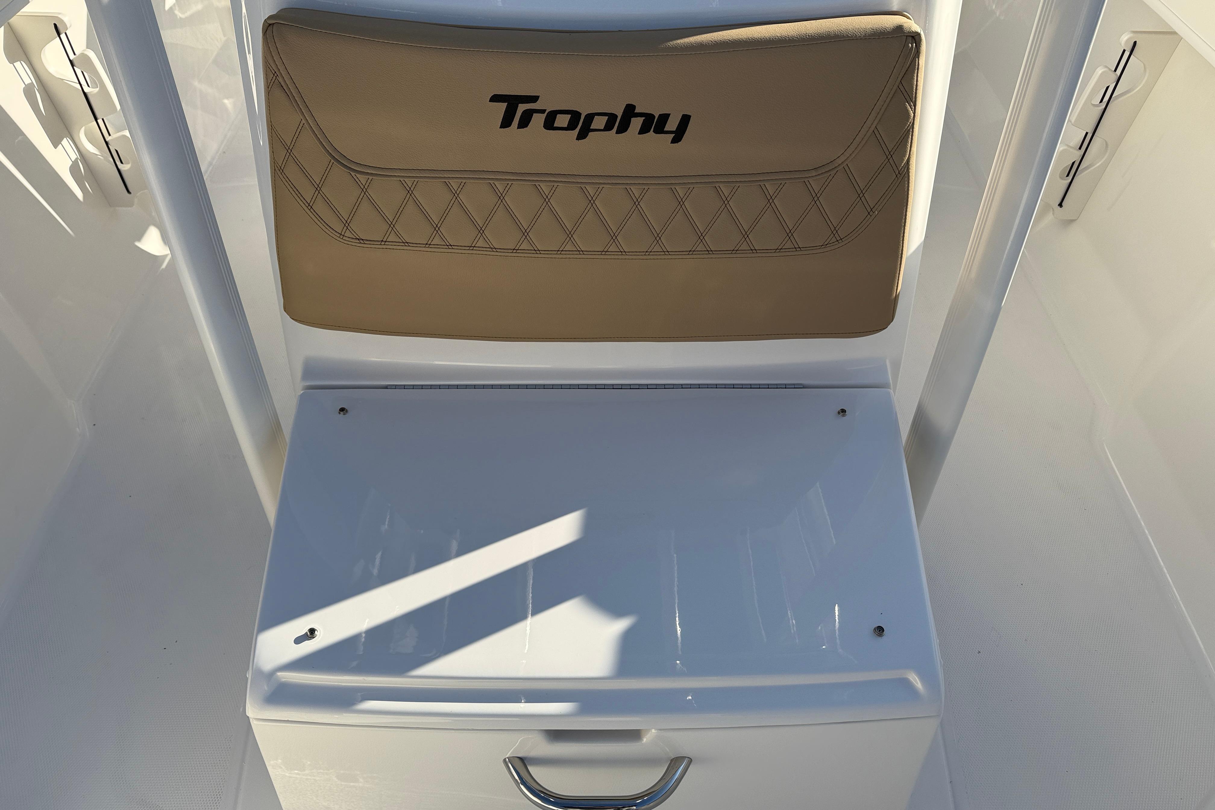 2026 Bayliner Trophy T22CC boat seat with storage compartment.