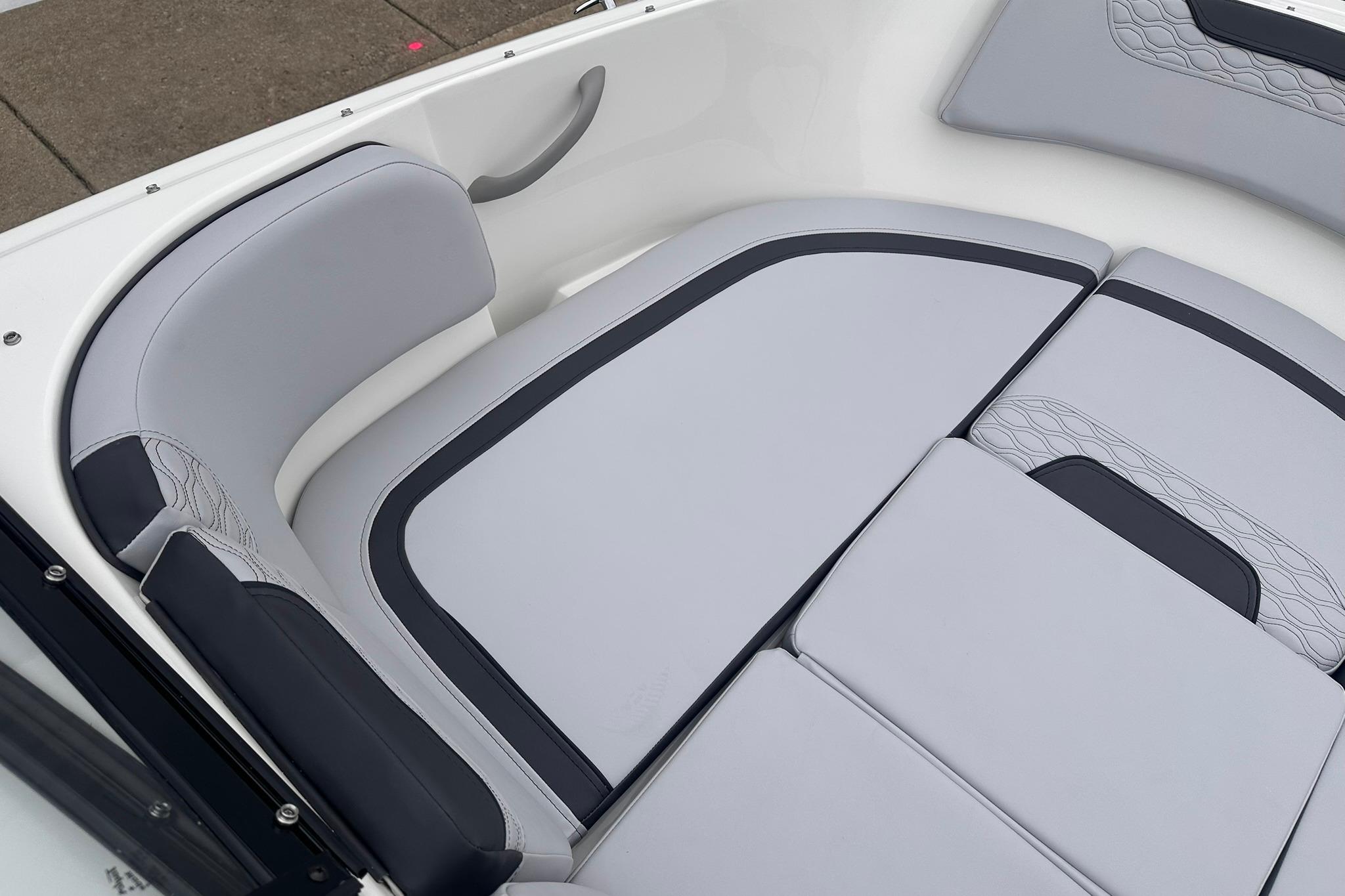 2026 Bayliner M17 boat interior with sleek gray seating and modern design.
