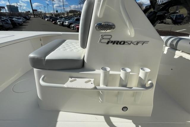 2026 Mako 18 Pro Skiff boat interior with seating and rod holders.