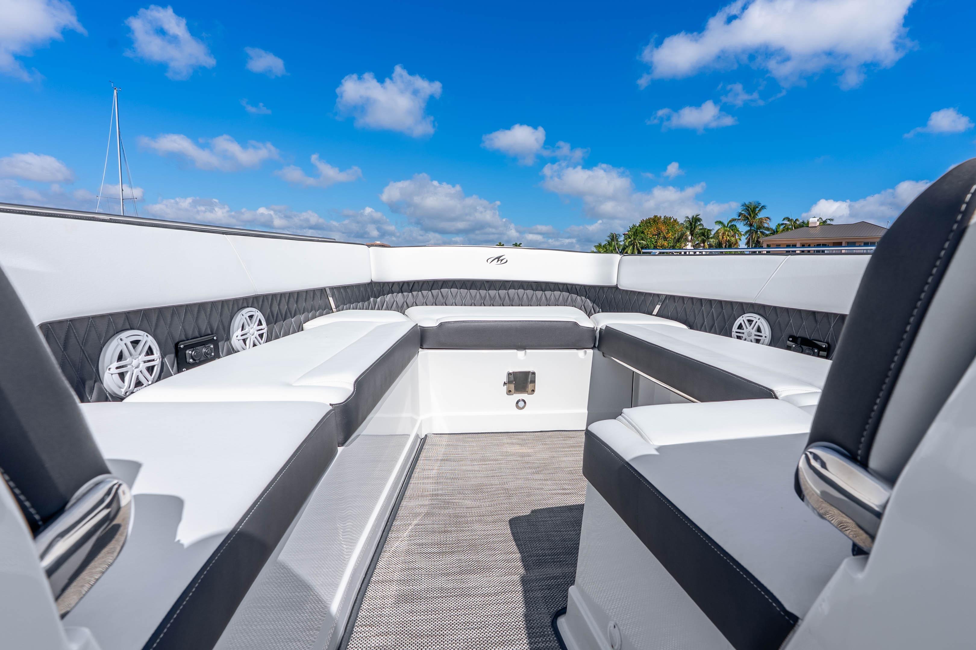 2022 Monterey 378SS Super Sport boat interior with luxurious seating under a clear blue sky.