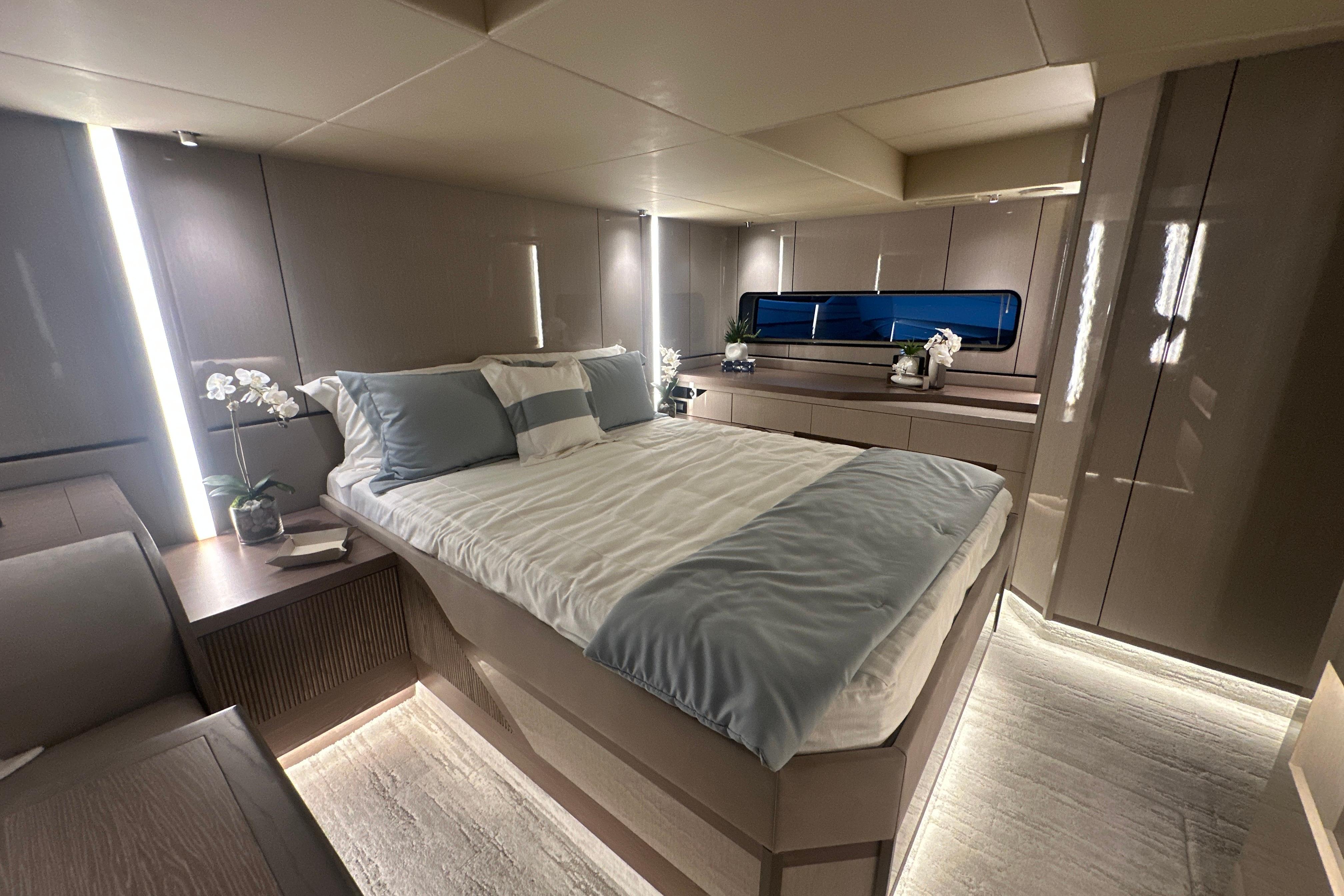 Luxurious bedroom interior of 2026 Cruisers Yachts 57 Fly, featuring modern design and elegant decor.