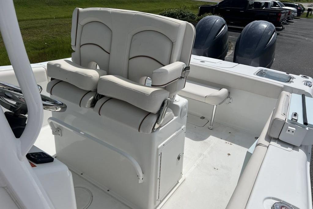2021 Sea Hunt Gamefish 25 boat interior with dual seats and twin engines.