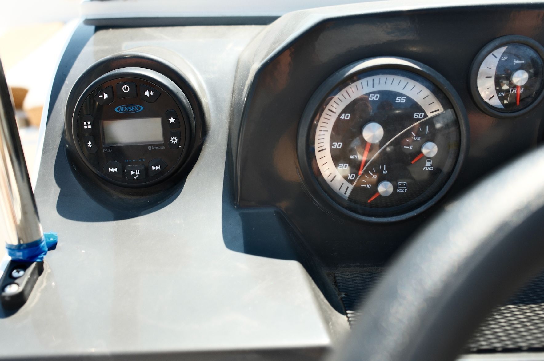 Close-up of a 2019 Bayliner VR4 Bowrider OB dashboard with speedometer and controls.