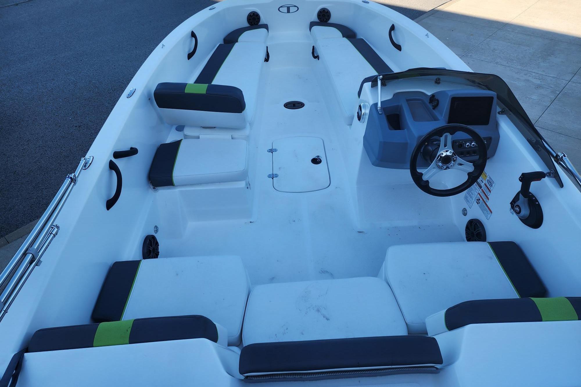 2023 Tahoe T18 boat interior with seating, steering wheel, and dashboard.