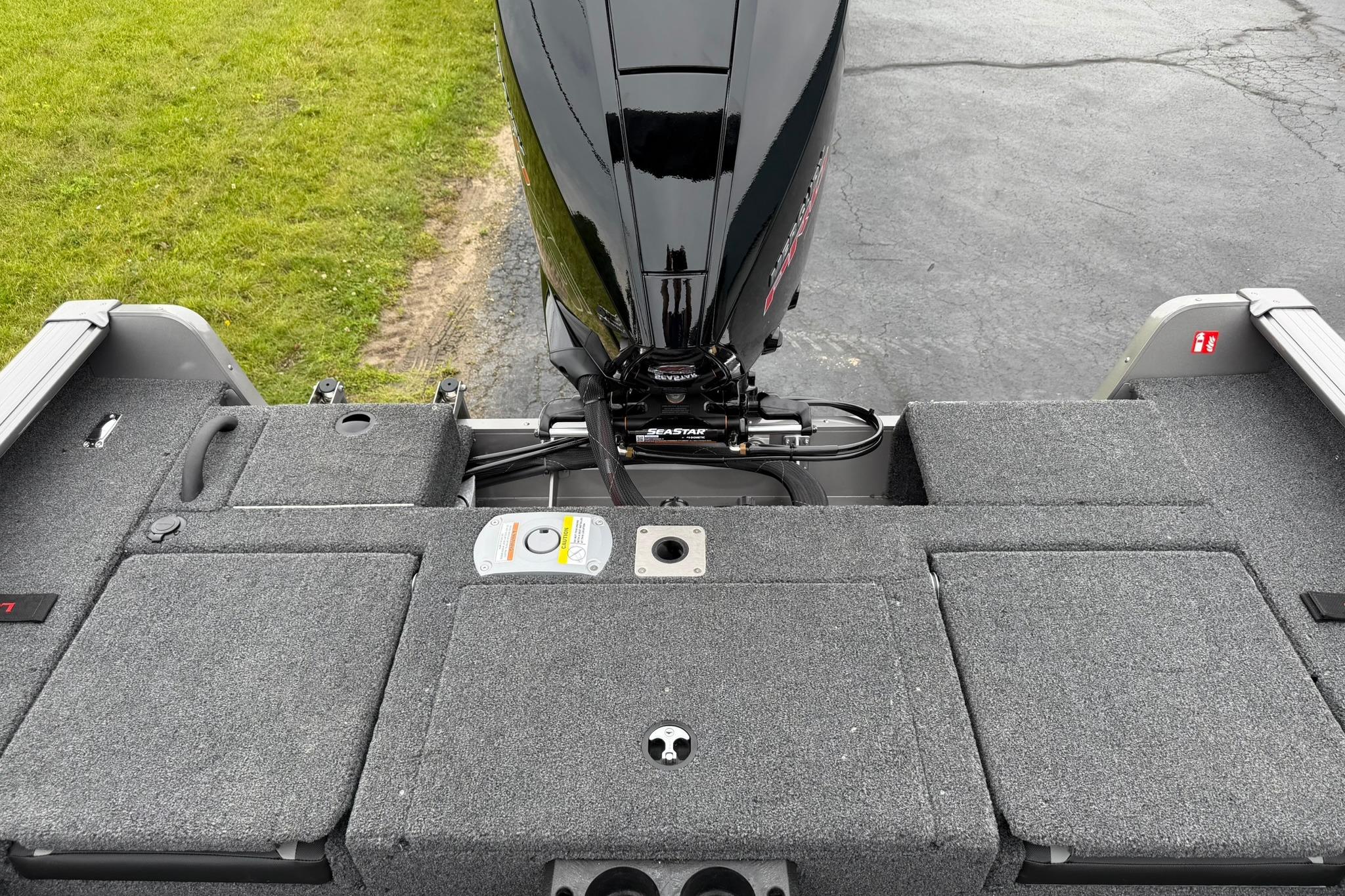 2027 Lund 2075 Impact XS boat with outboard motor, viewed from above.