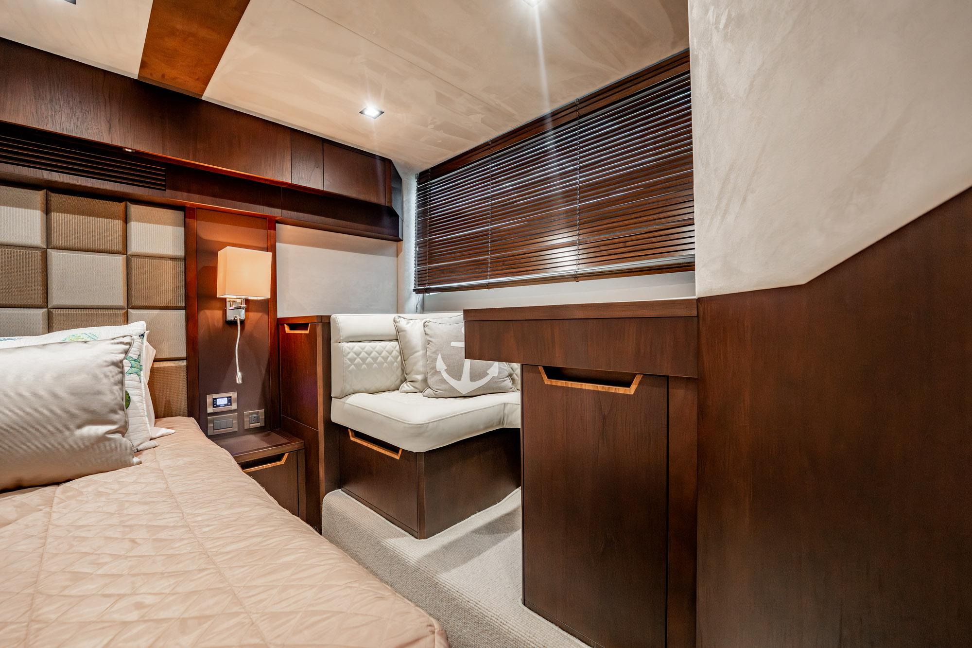 Luxurious interior of 2017 Galeon 510 Sky yacht with elegant wood finishes and cozy seating.