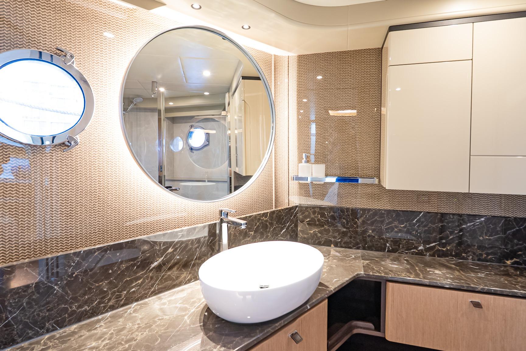 Luxurious bathroom interior on 2026 Absolute 60 Fly yacht with modern fixtures and elegant design.