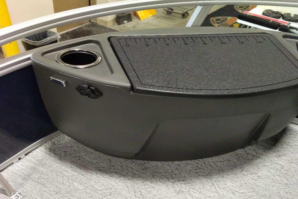 2026 Sun Tracker Bass Buggy 18 DLX boat console with cup holder and measuring surface.