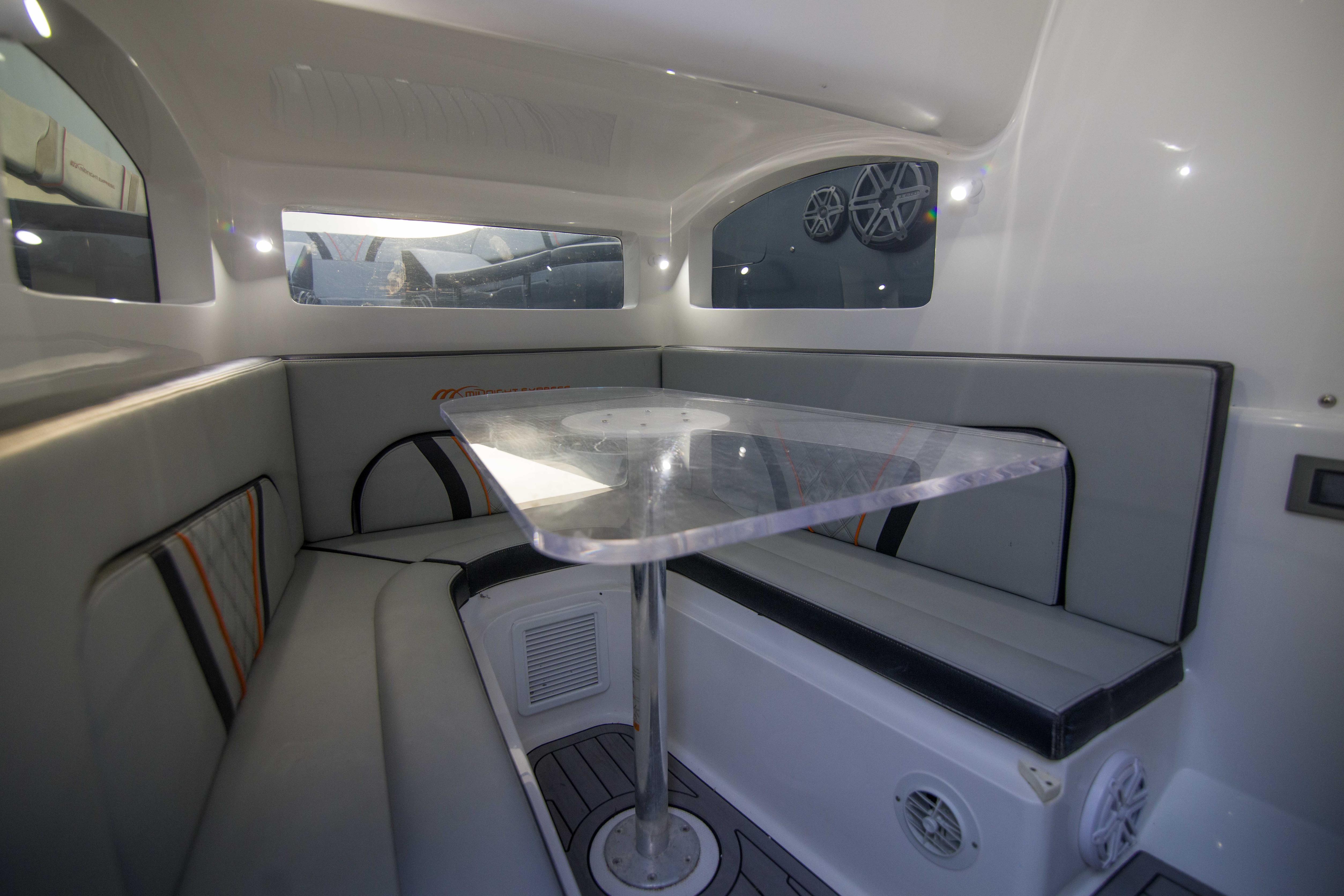 Interior of 2019 Midnight Express 43 Open boat with seating and table.