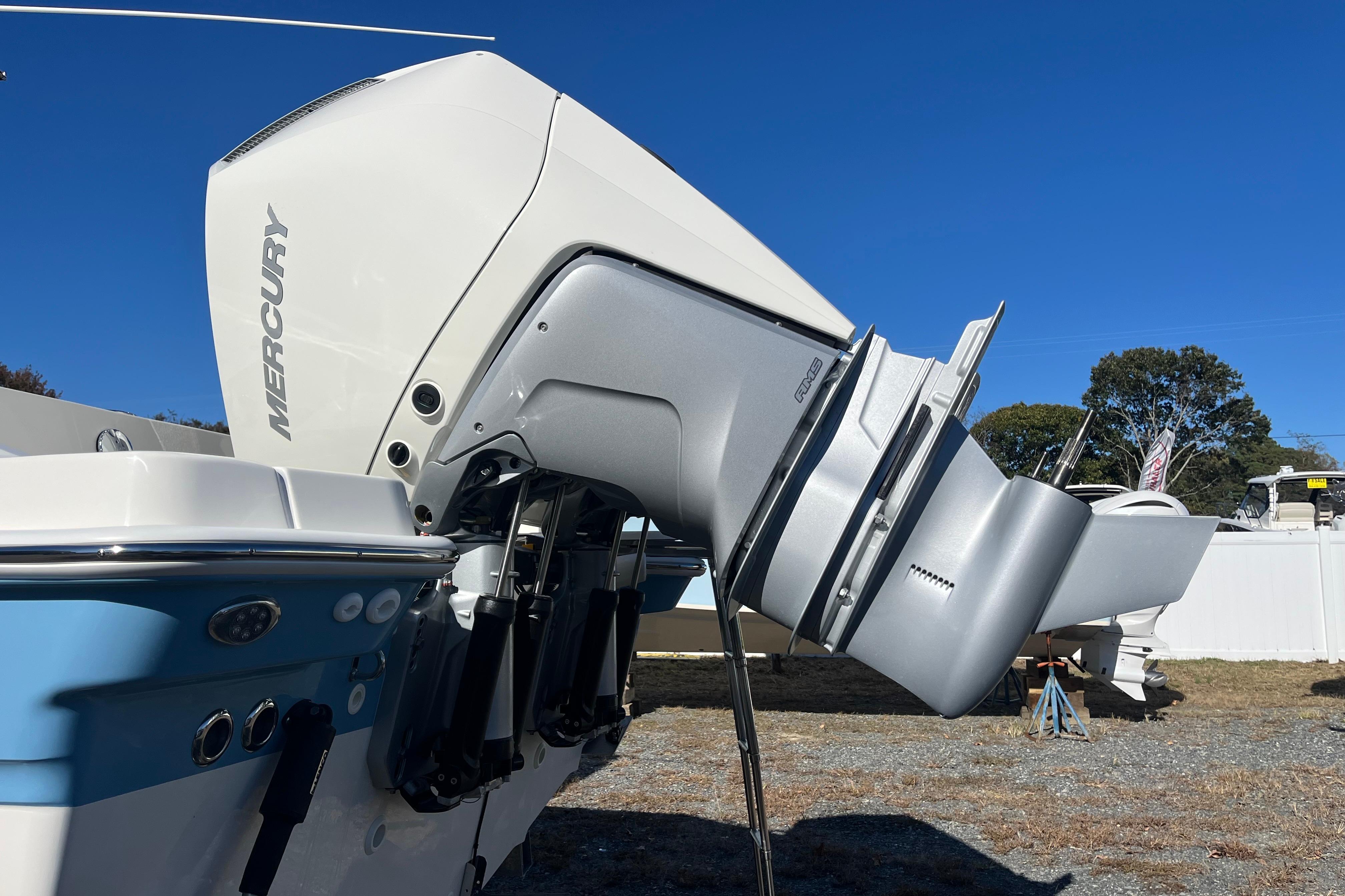2026 Boston Whaler 280 Dauntless with Mercury outboard engine, displayed outdoors.