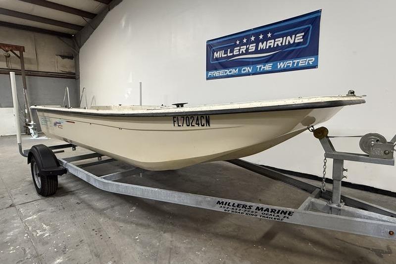 1998 Carolina Skiff 1965 V boat on trailer at Miller's Marine showroom.