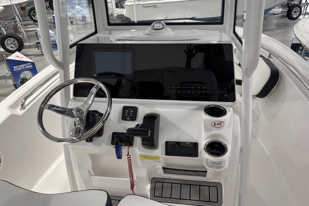 2026 Tidewater 198 CC Adventure boat dashboard with steering wheel and control panel.