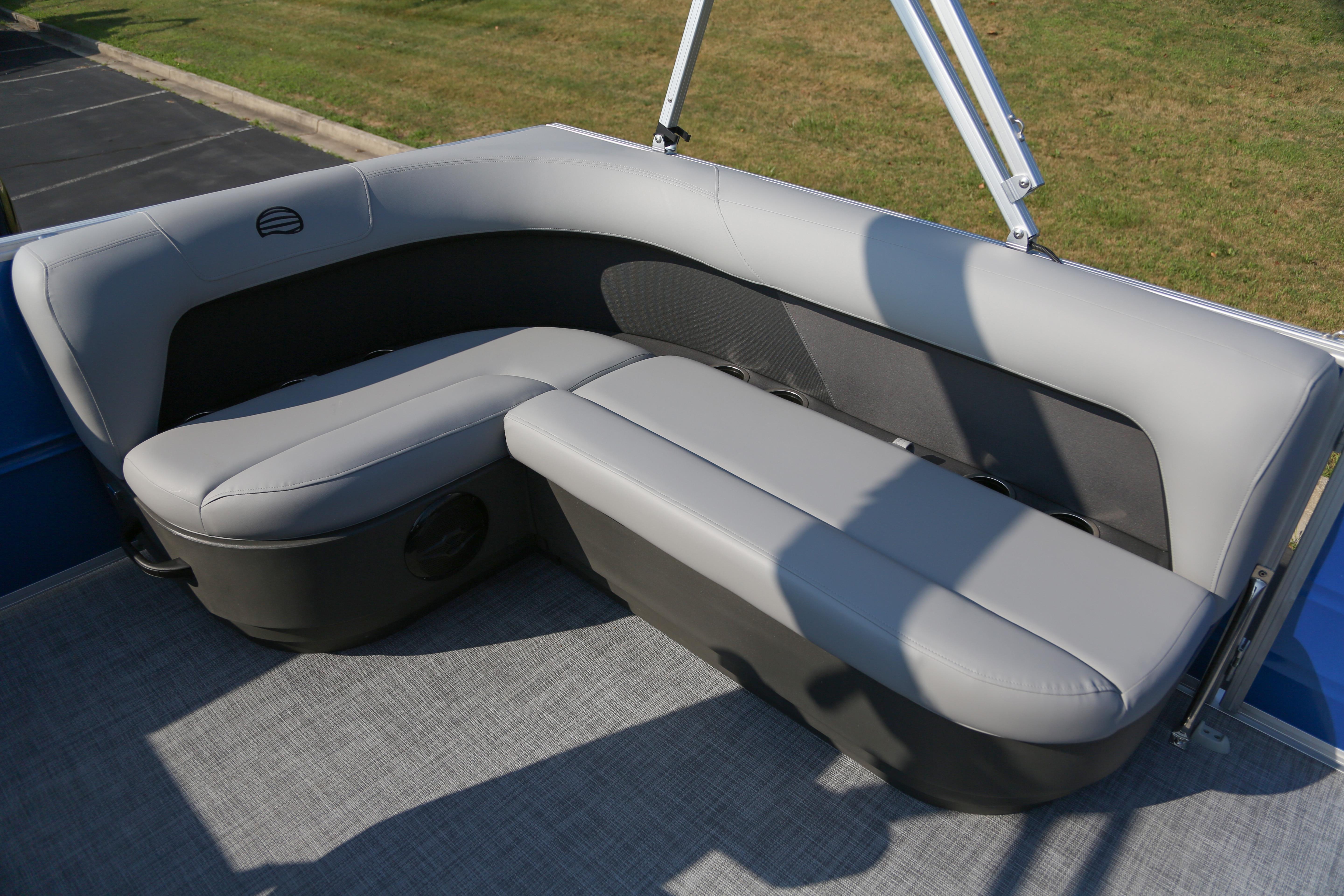 2026 Sun Tracker Party Barge 16 DLX pontoon boat seating, featuring gray cushioned benches.