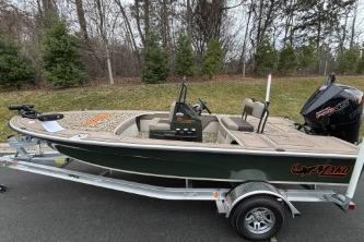 2025 Mako 18 Pro Skiff Backwater Edition on trailer, parked outdoors.