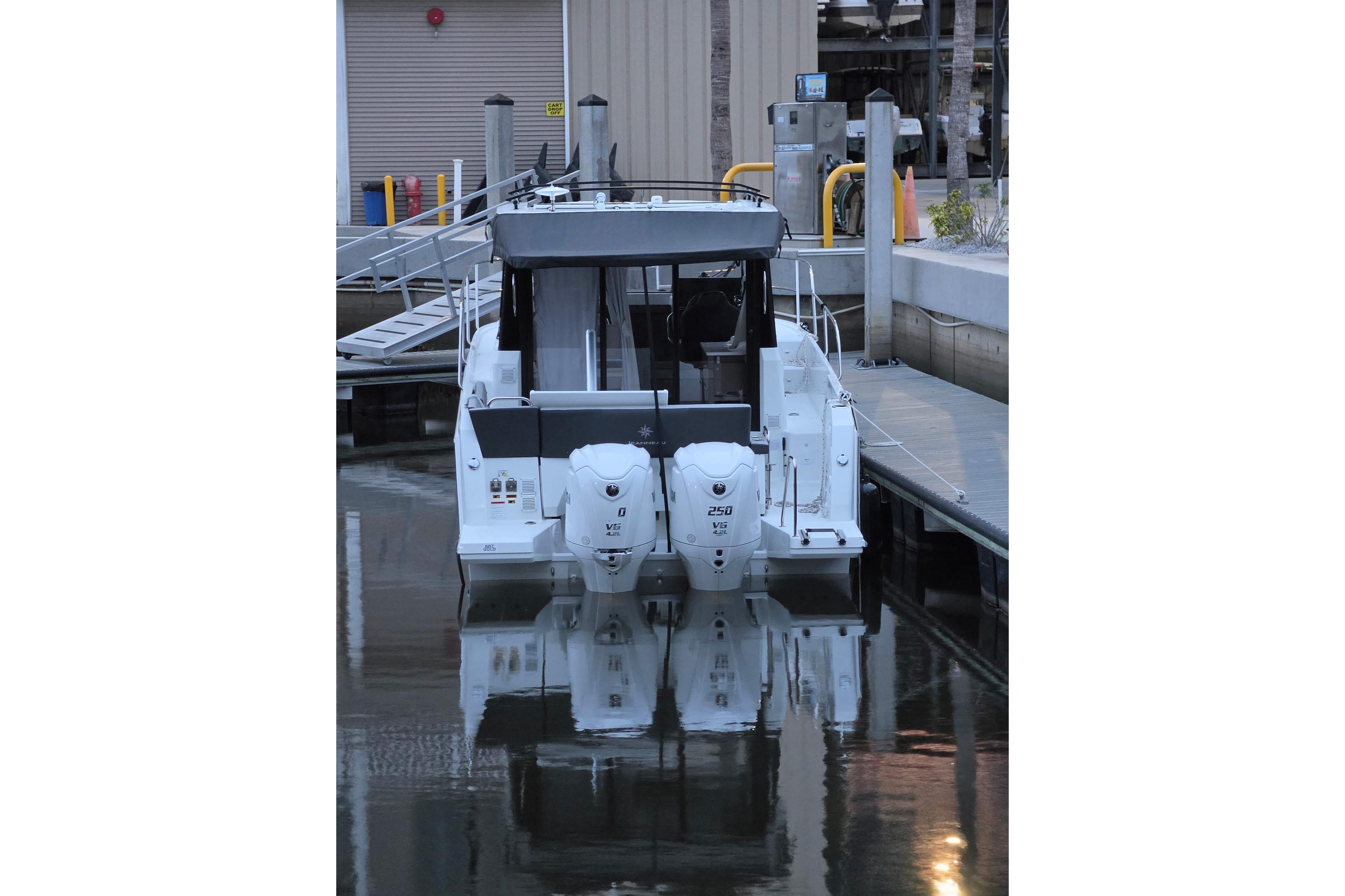 2026 Jeanneau NC 895 Series 2 boat docked with twin outboard engines.