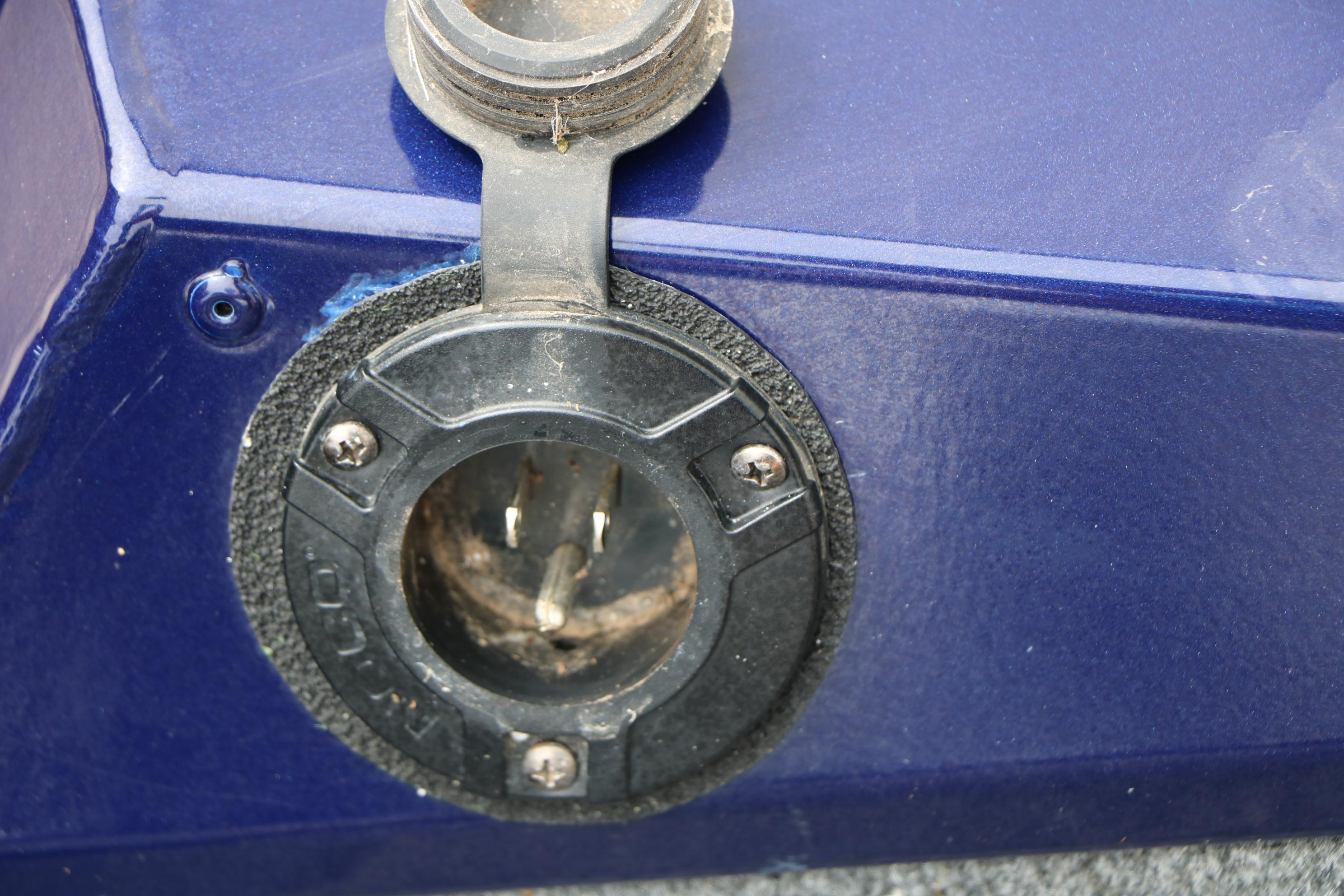 Close-up of a 2022 Tracker Pro Team 175 TF boat plug socket.