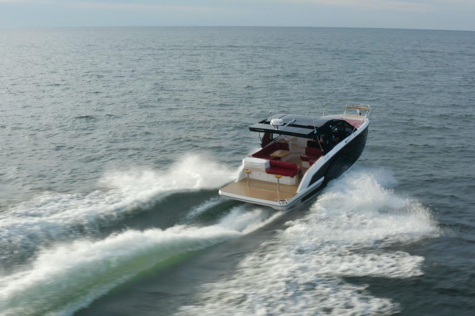 2026 Hanover 387 boat cruising on open water, showcasing sleek design and powerful performance.