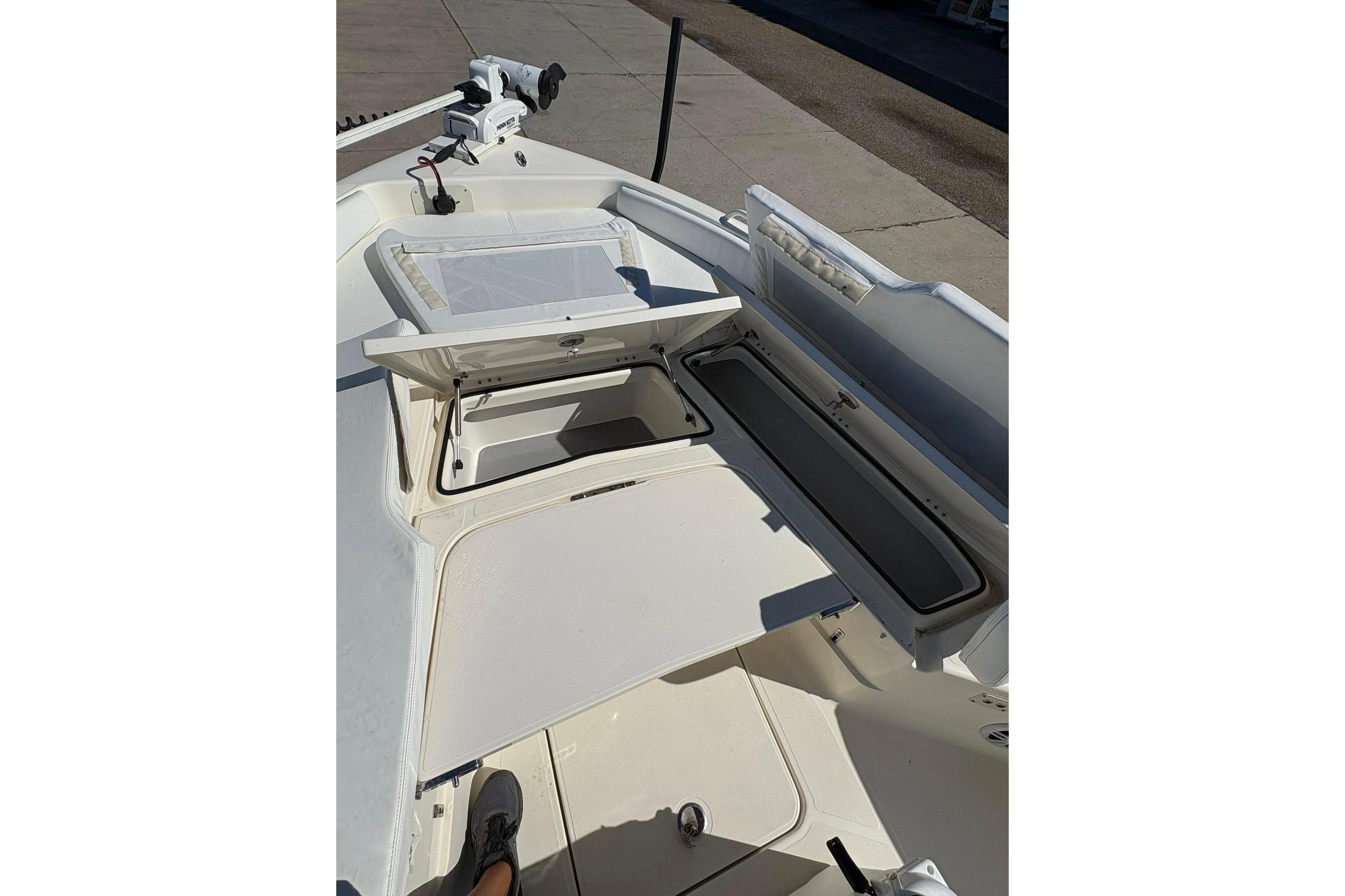 2023 Skeeter SX2550 Family boat interior with open storage compartments.