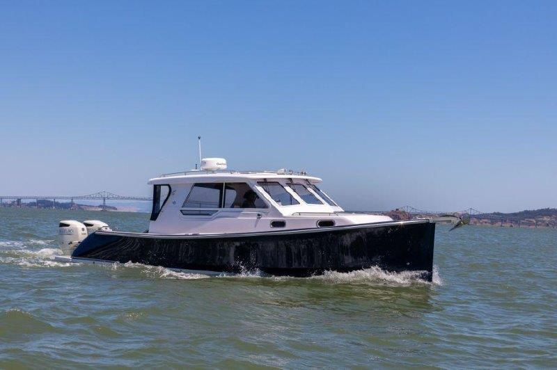 2024 True North 34 boat cruising on open water.