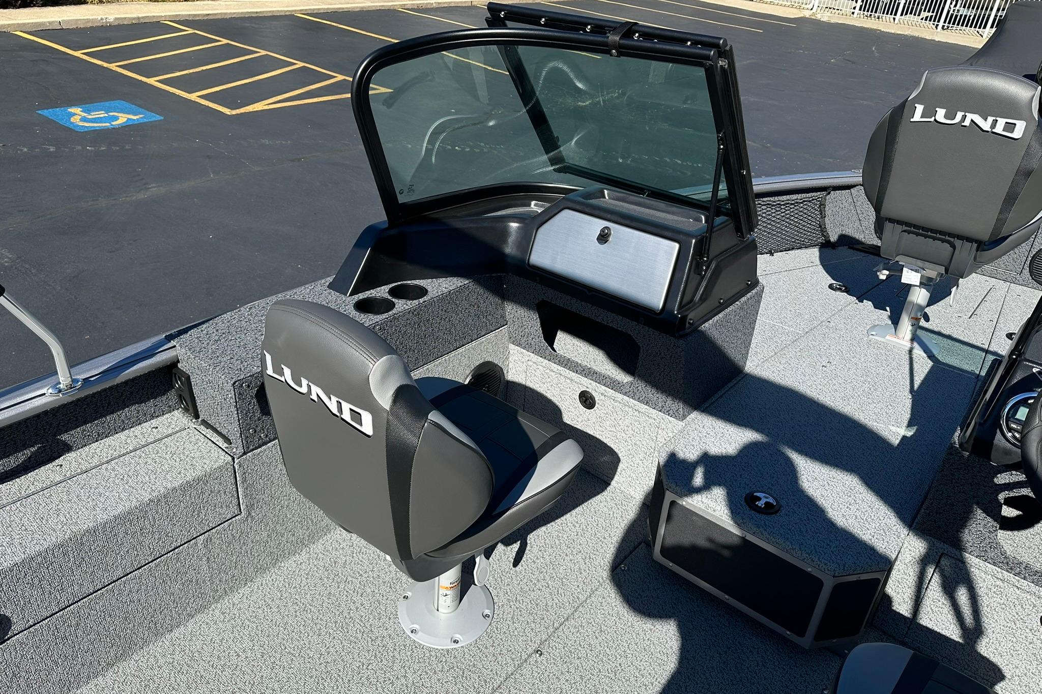 2026 Lund 1875 Impact XS Sport boat interior with seating and console.