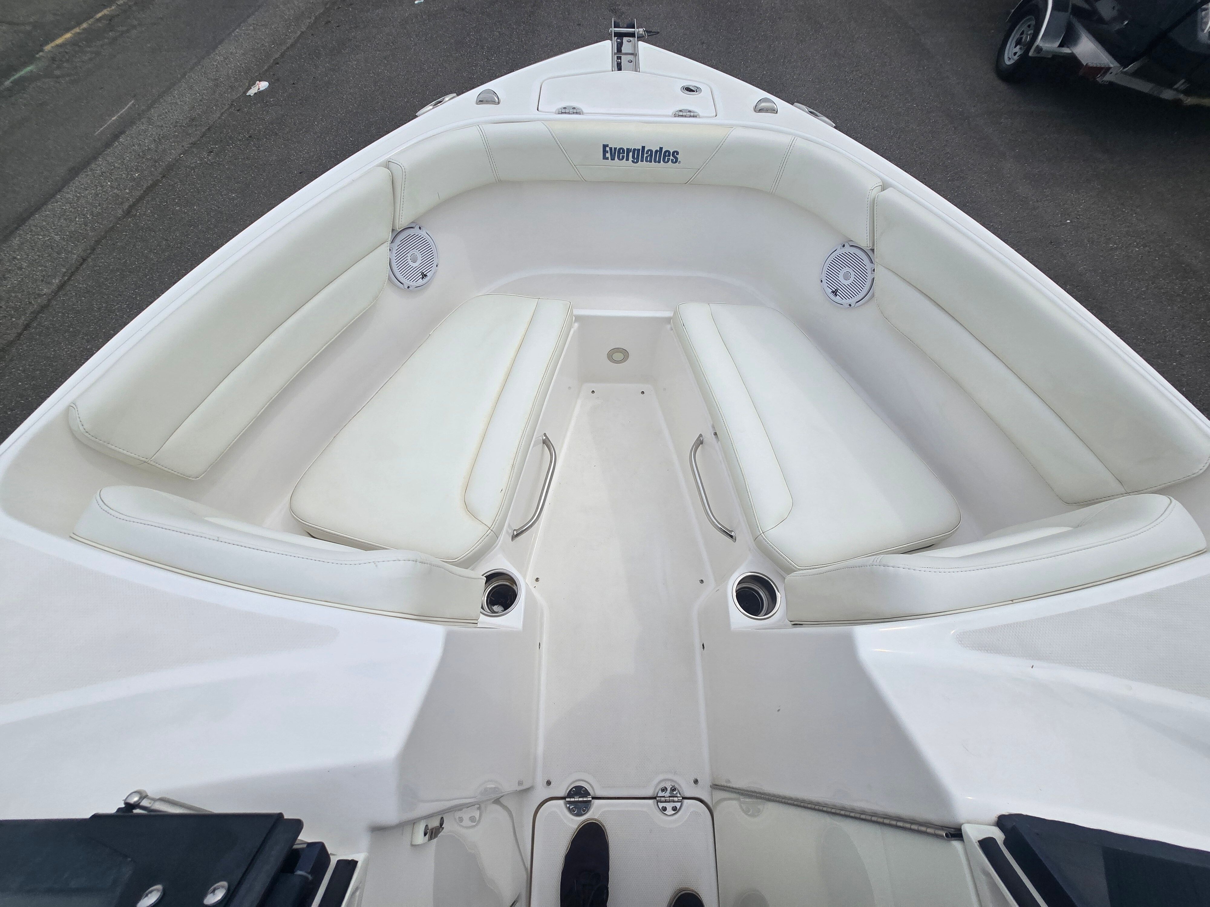 2017 Everglades 230 Dual Console with white cushions and speakers in the bow area.