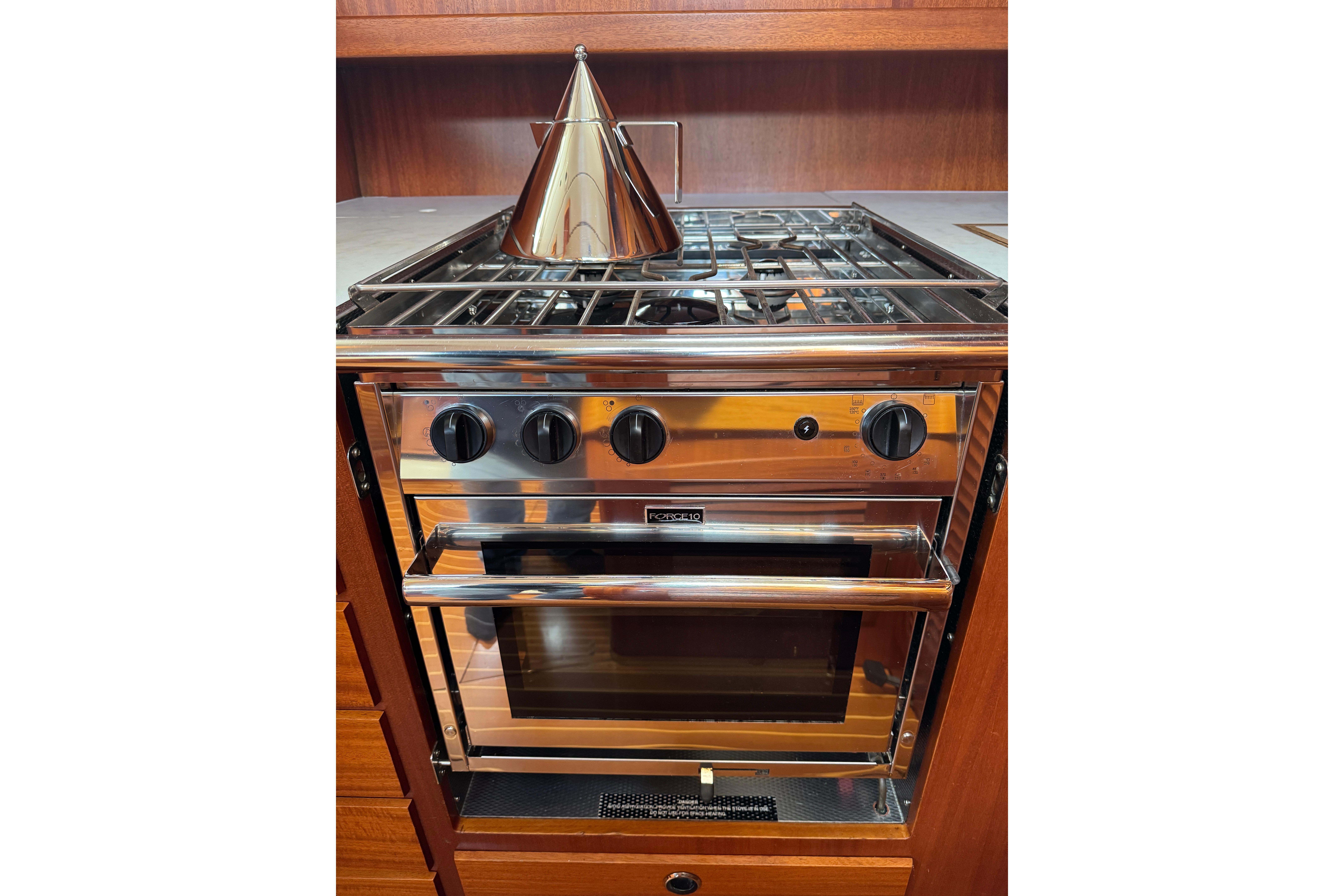 Stainless steel stove and oven in 2003 Hallberg-Rassy 46 yacht kitchen.