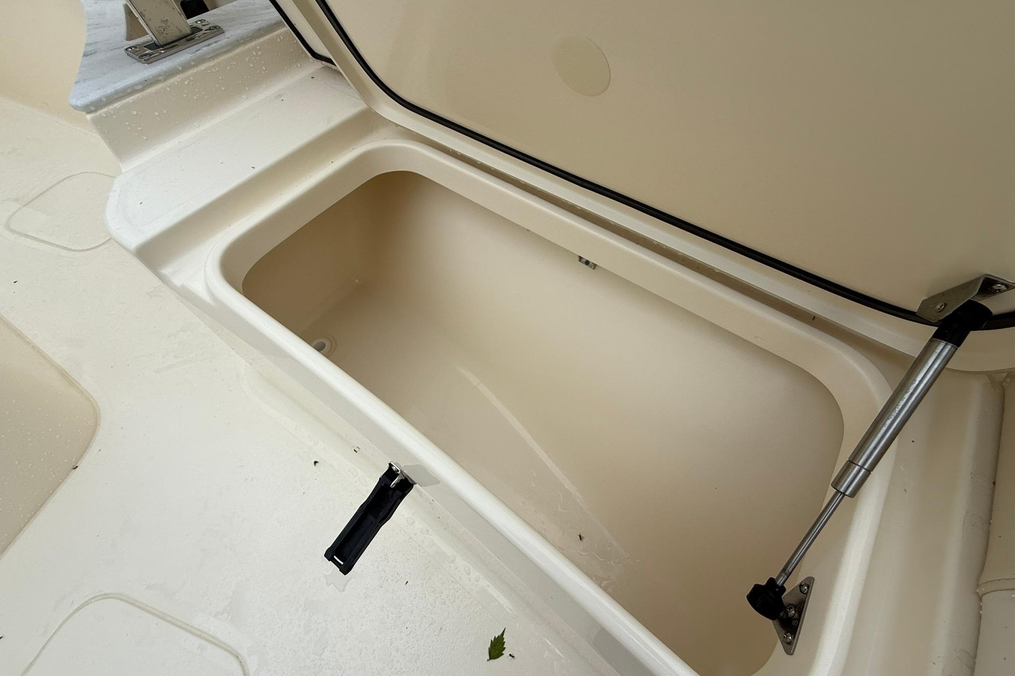 Open storage compartment on 2026 Scout 260 LXF boat.