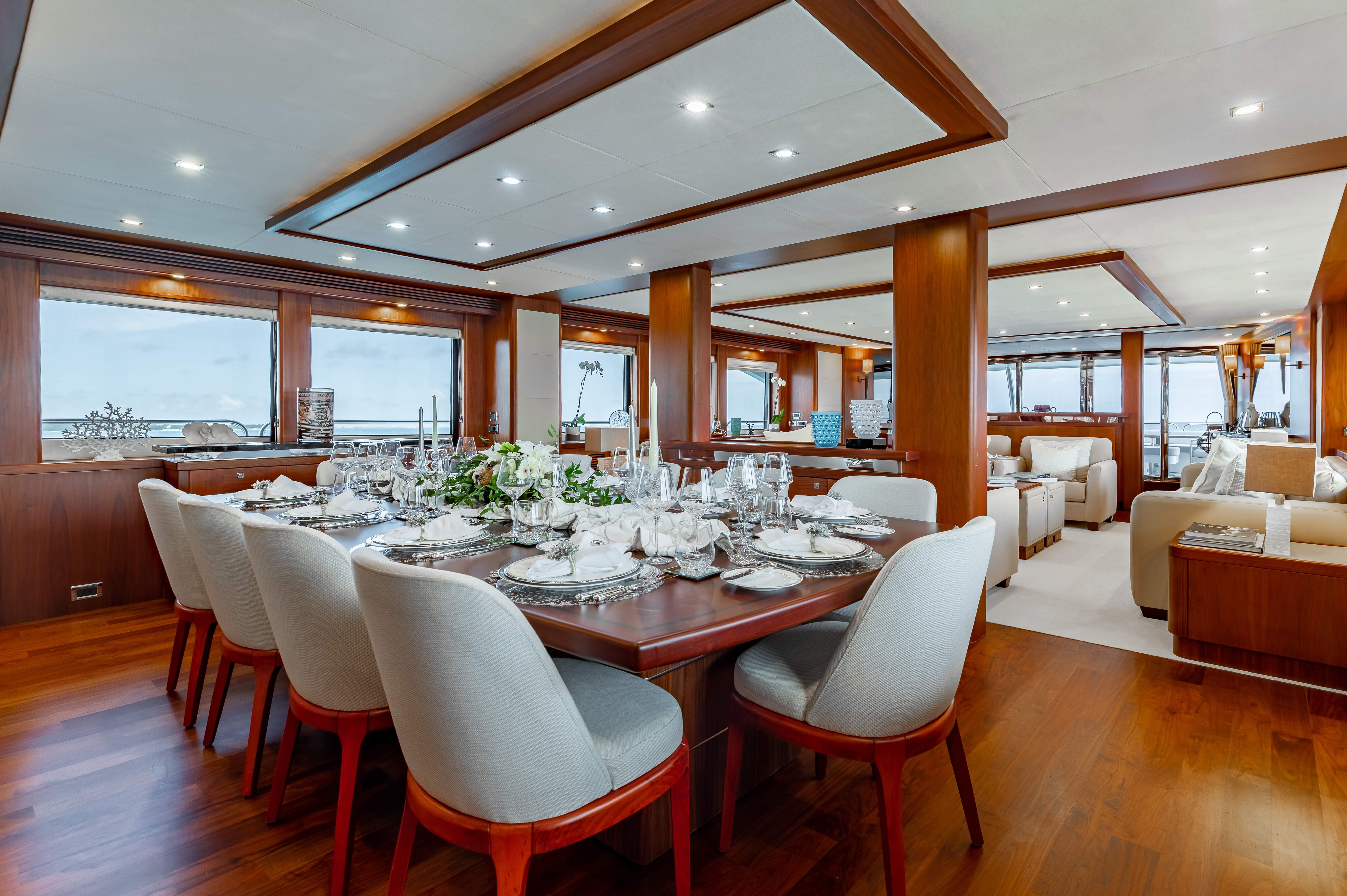 Luxurious dining area on a 2009 Sunseeker 121 yacht with elegant table setting.
