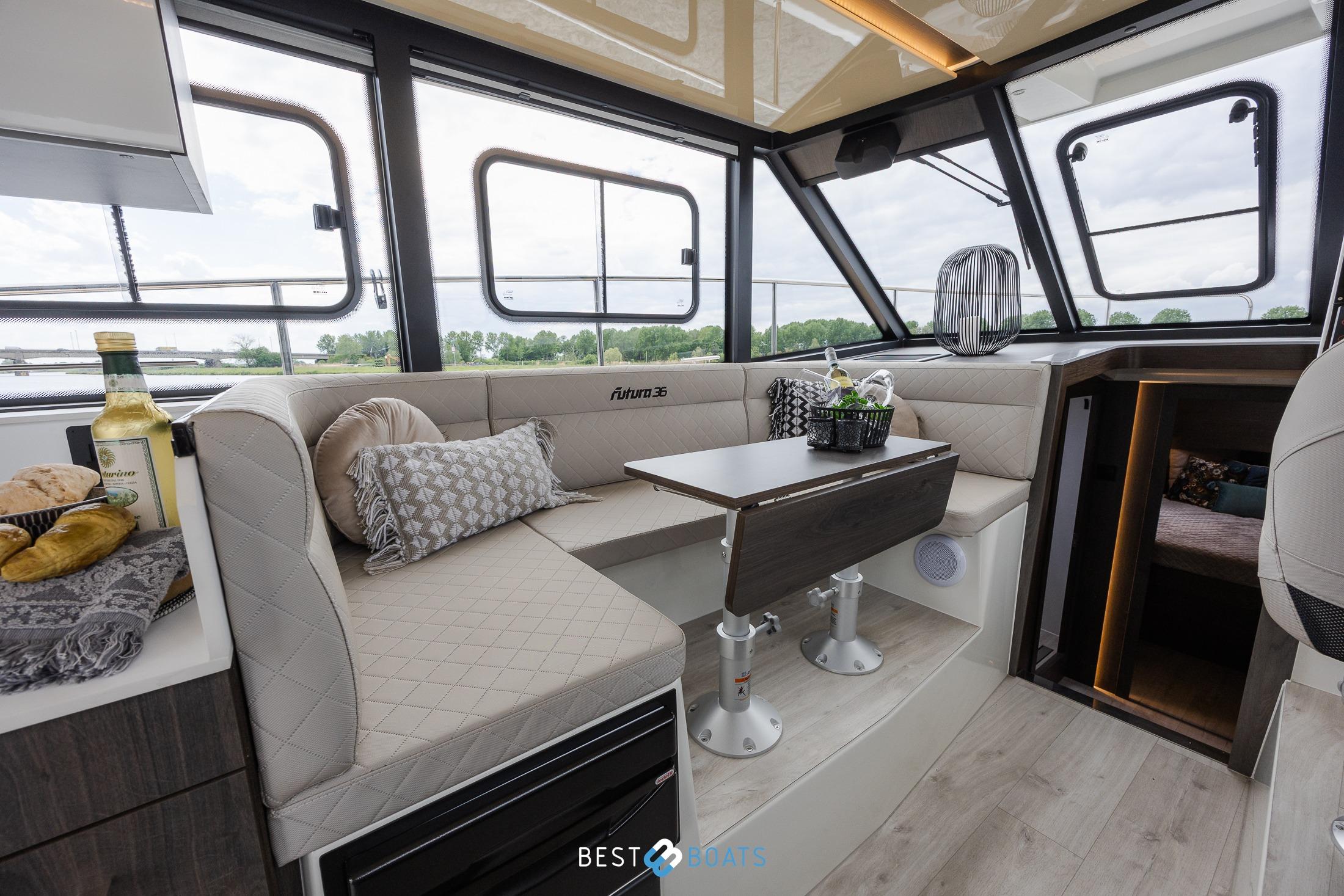 Luxurious interior of 2023 Cobra Yachts Futura 36 Premium Fly with elegant seating and dining area.