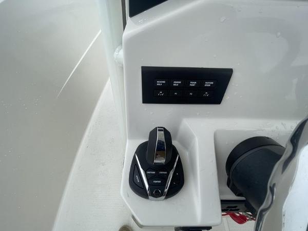 Control panel of 2023 Sailfish 290 CC boat with switches and throttle.