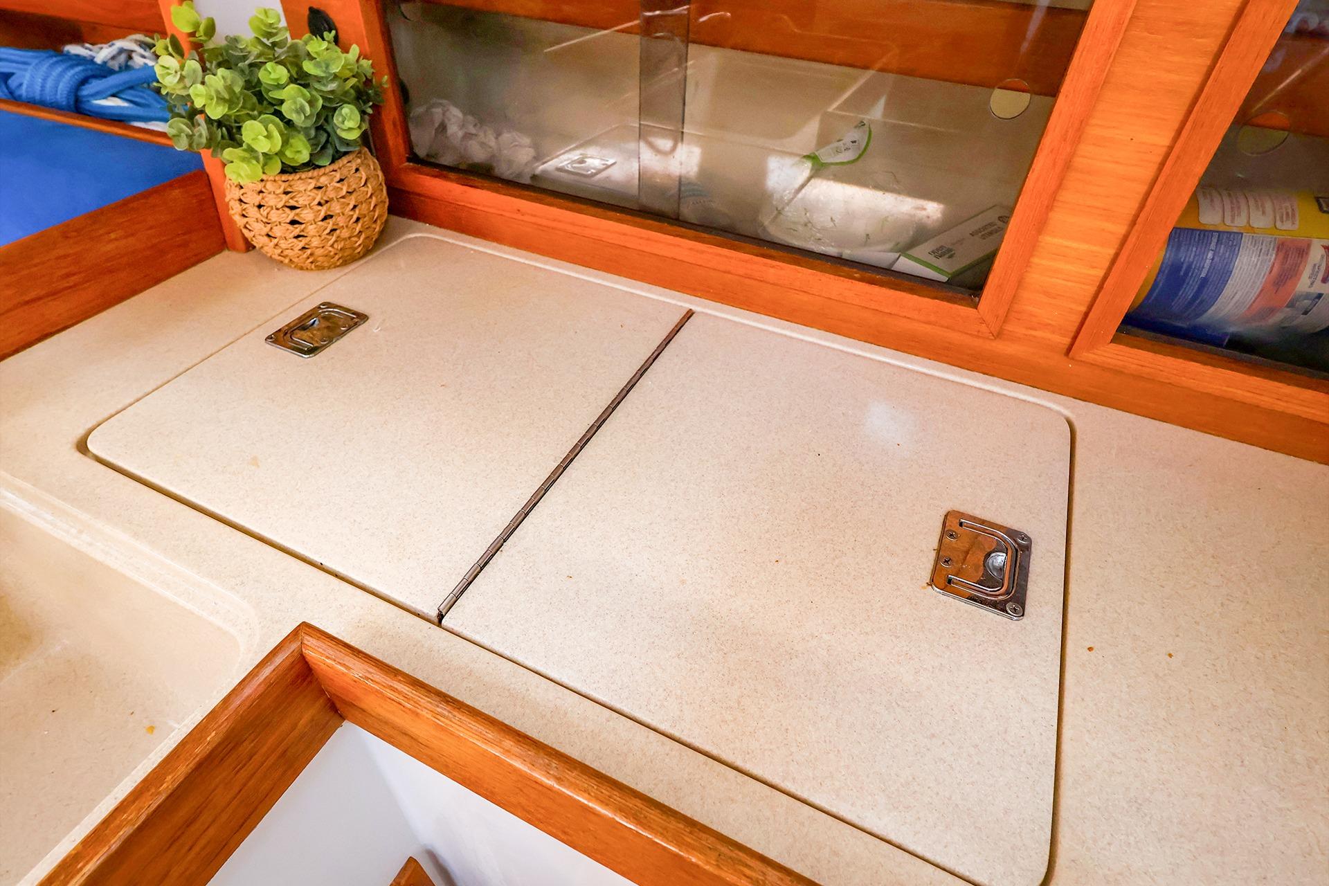 Interior of 2001 J Boats J/32 sailboat with countertop and storage compartments.