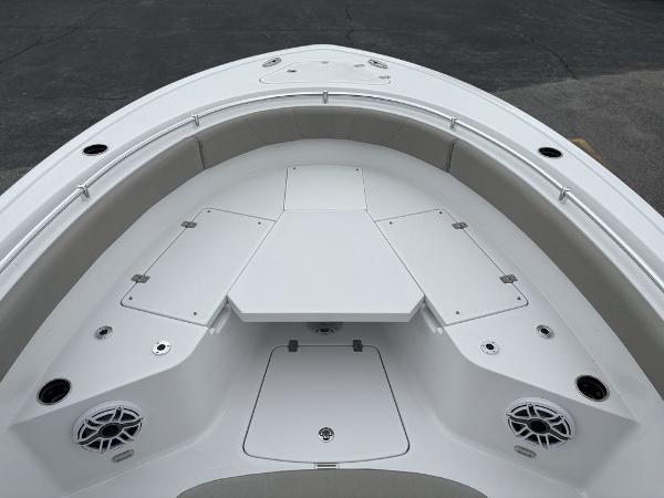 2025 Sportsman Open 232 boat deck with seating and storage compartments.