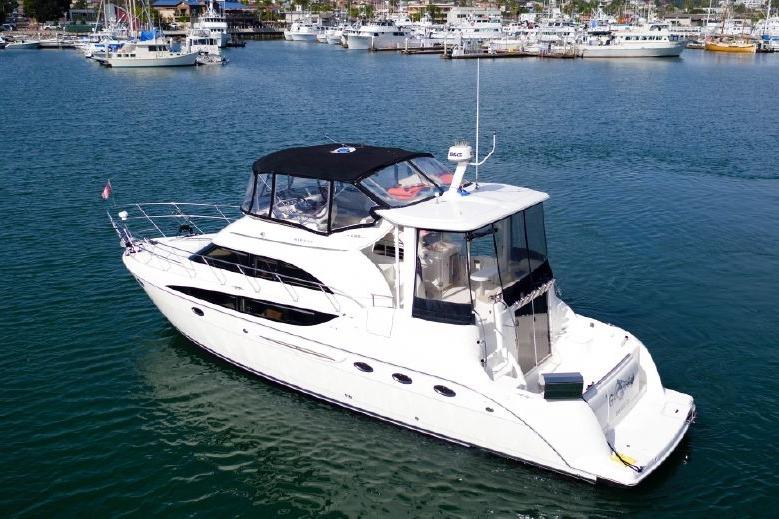 2004 Meridian 459 Motoryacht on calm water, featuring sleek design and spacious deck.