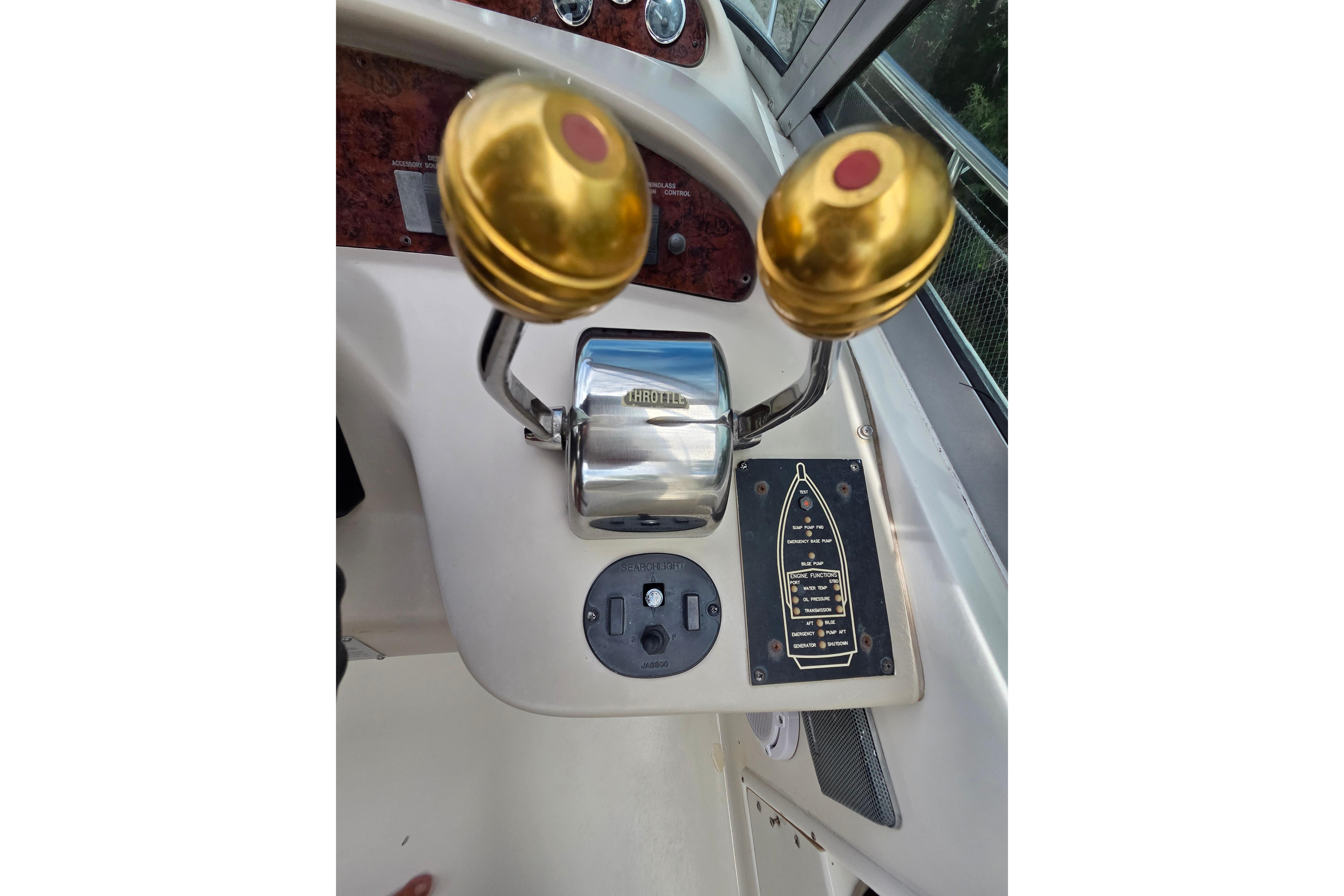 Throttle controls on a 2000 Sea Ray 340 Sundancer boat dashboard.