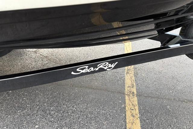 2017 Searay SPX210 boat trailer with Sea Ray logo on pavement.