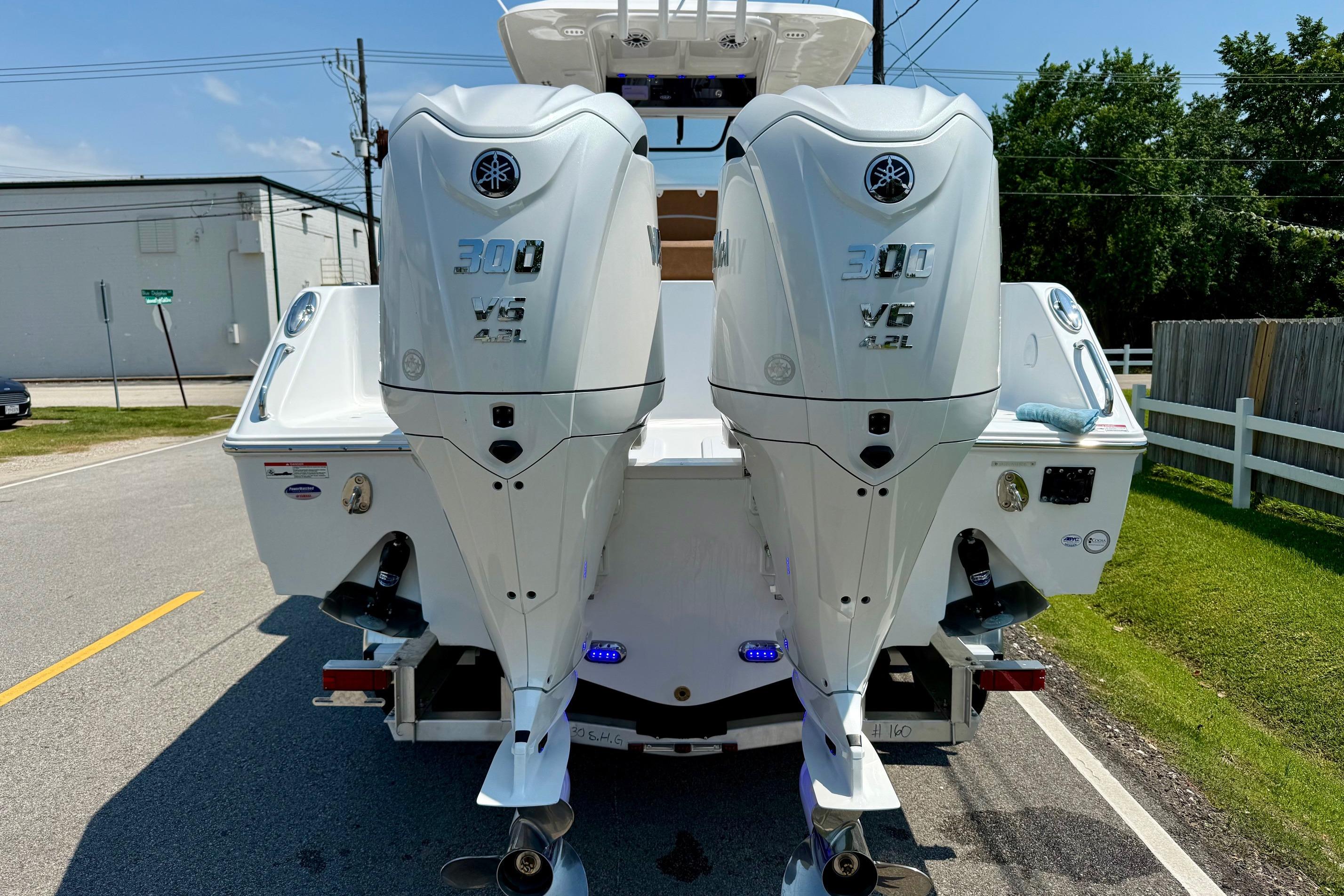 2026 Sea Hunt Ultra 305 SE with dual Yamaha 300 V6 outboard engines.
