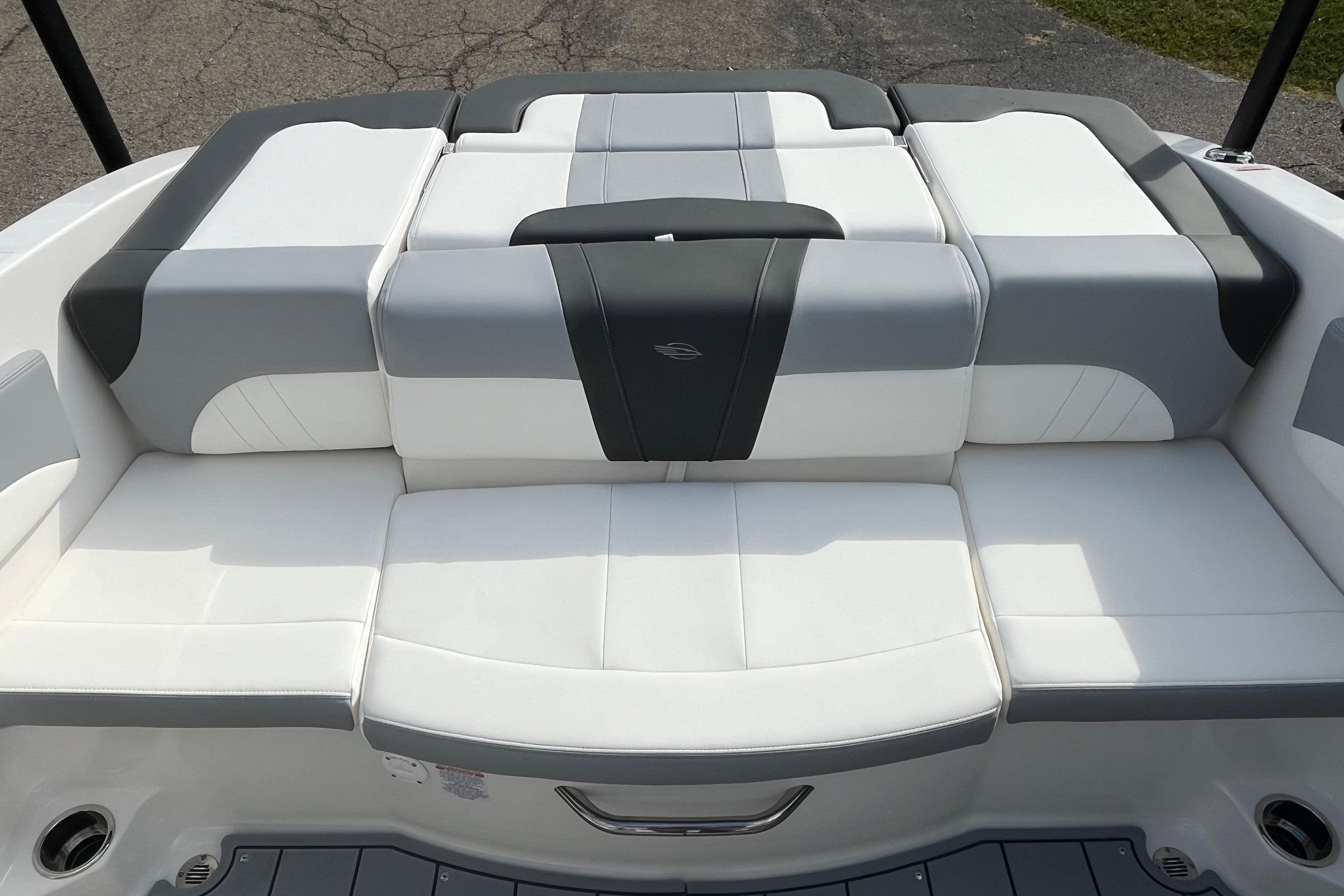 2026 Chaparral 21 SSi boat interior with white and gray cushioned seating.