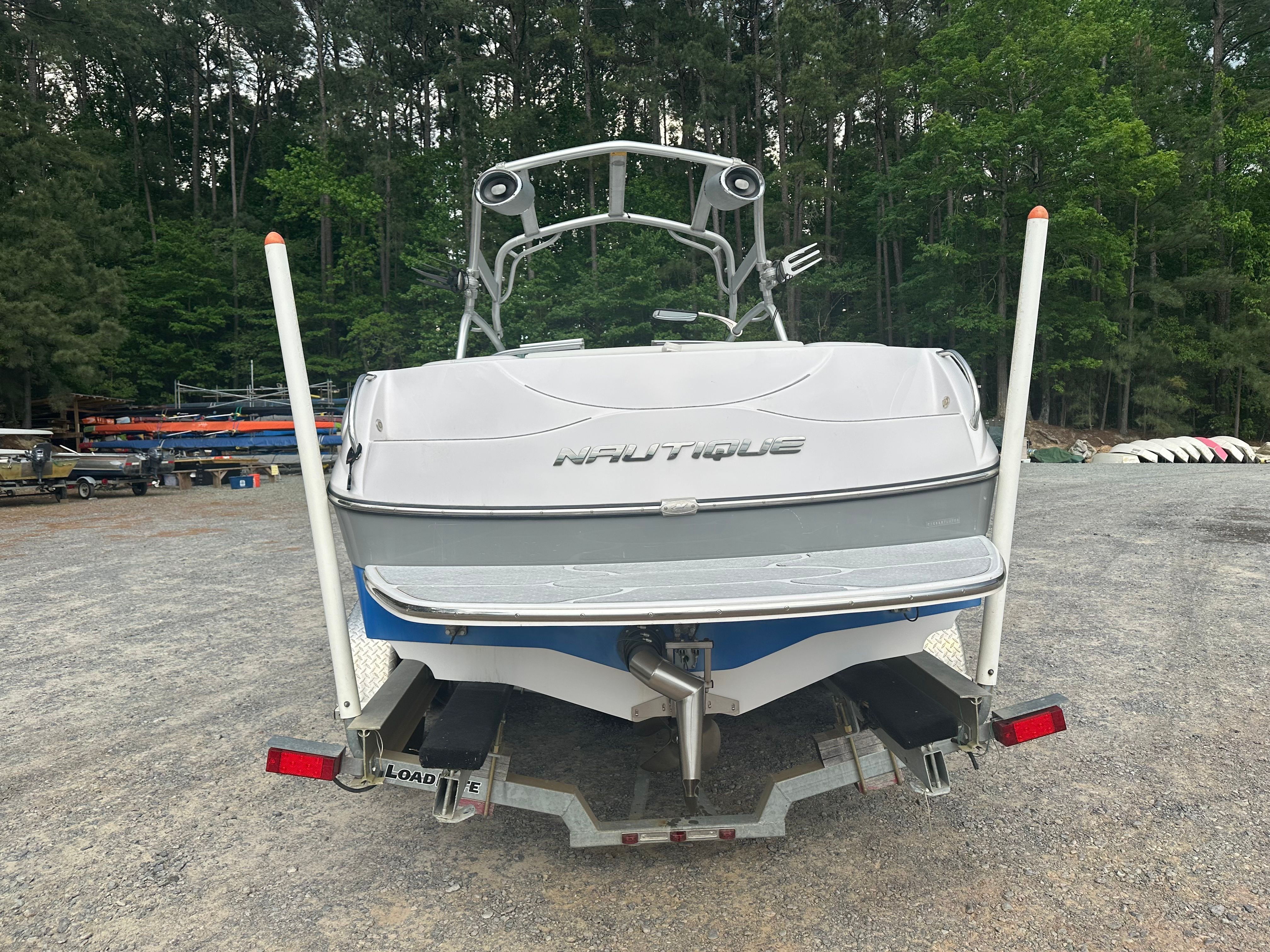 Rear view of a 2008 Nautique Super Air Nautique 220 on a trailer.