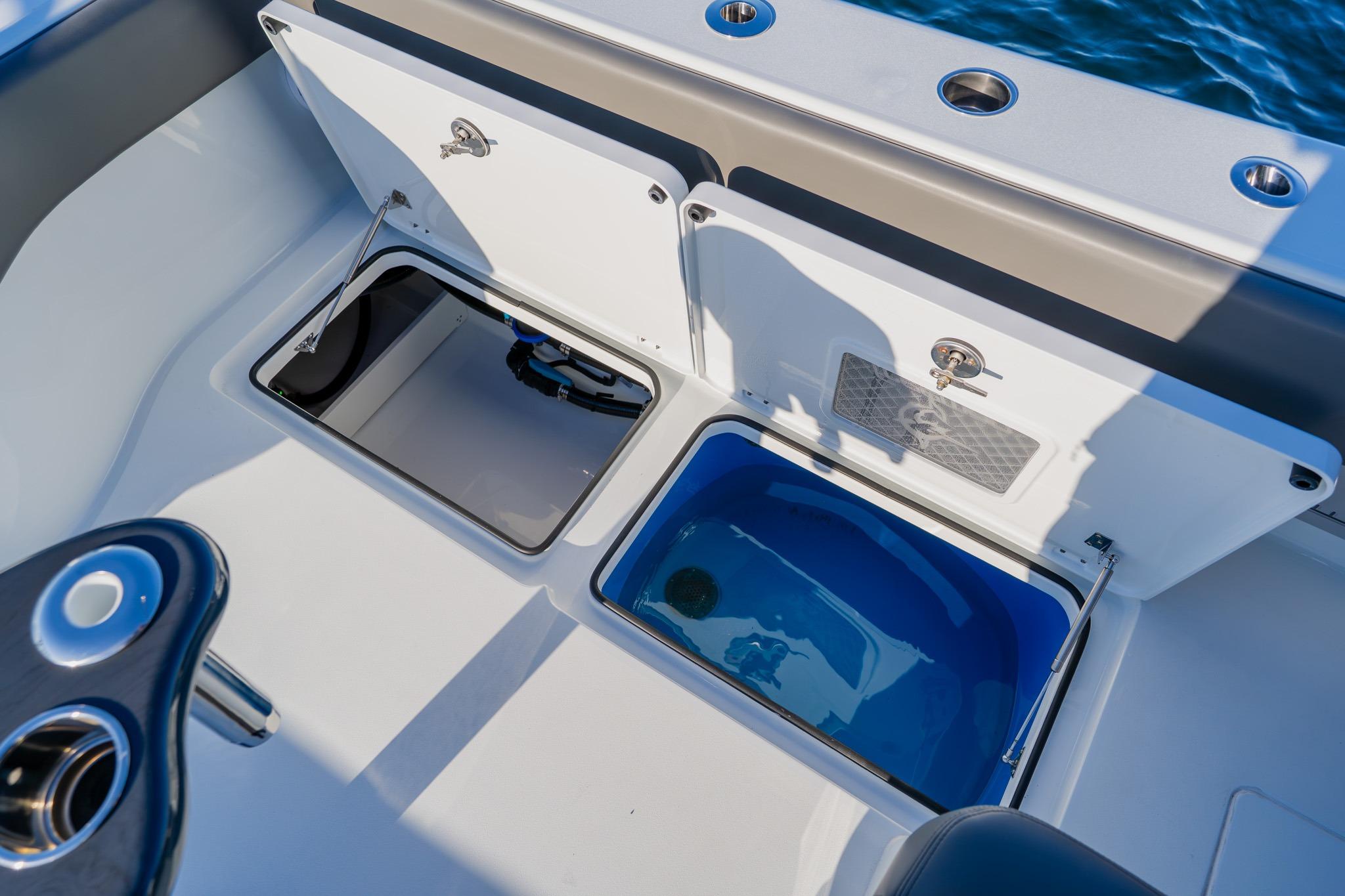 Freeman 42LR 2025 boat storage compartments with open hatches, showcasing interior features.