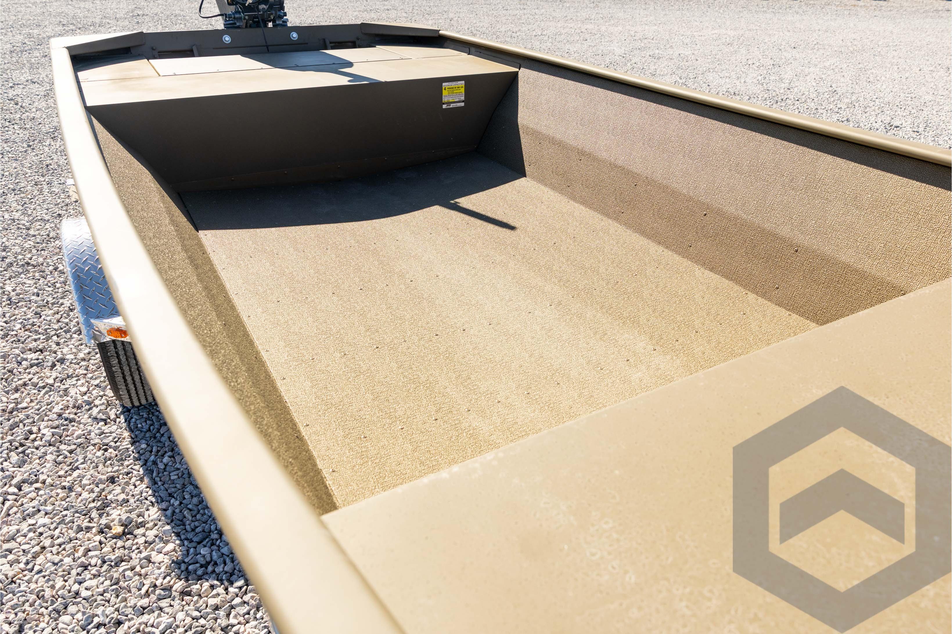 2026 G3 1652 VBW boat interior, empty and spacious, on gravel surface.