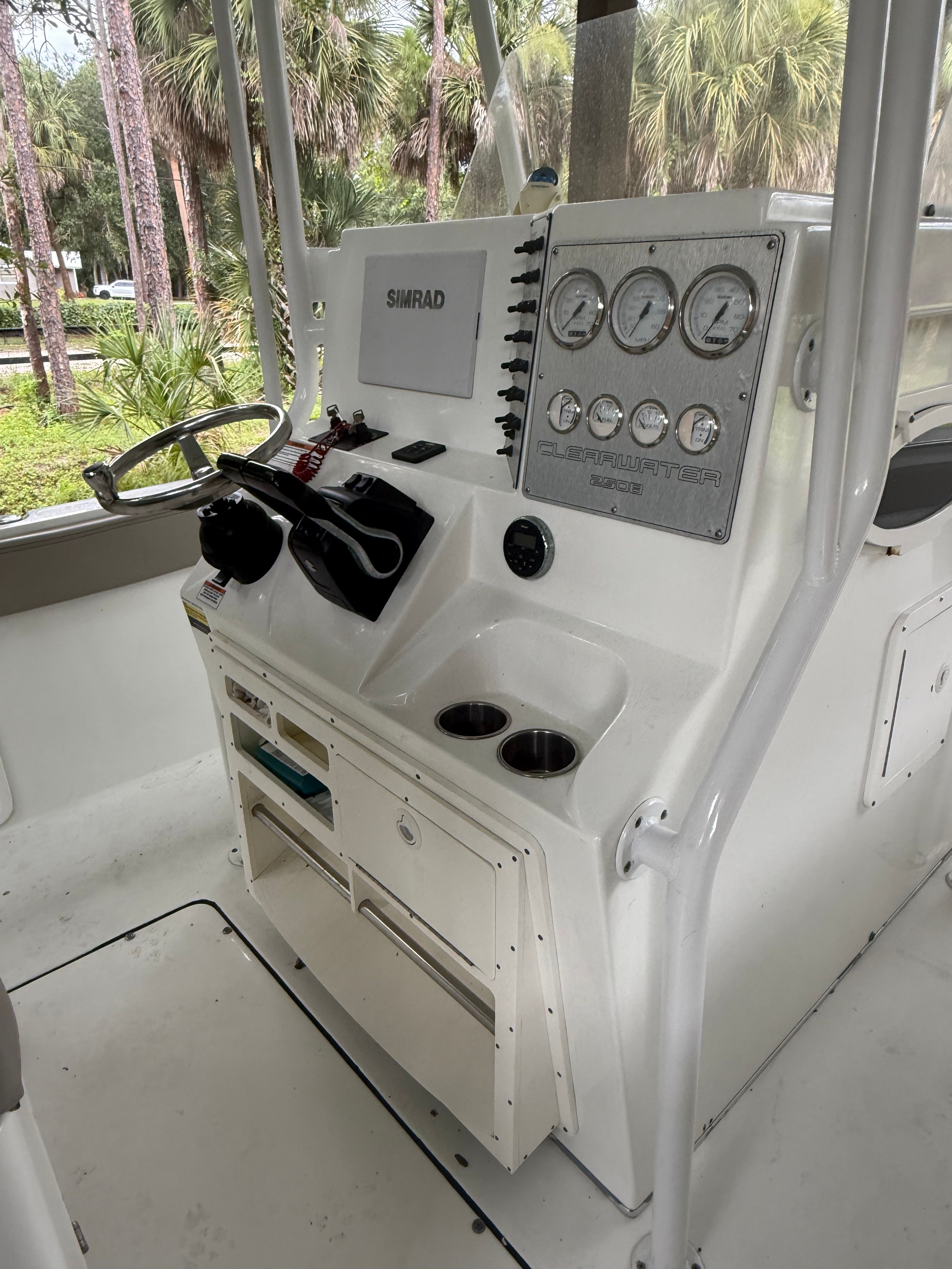 The image shows the helm of a 2021 Clearwater 2508 Center Console boat.