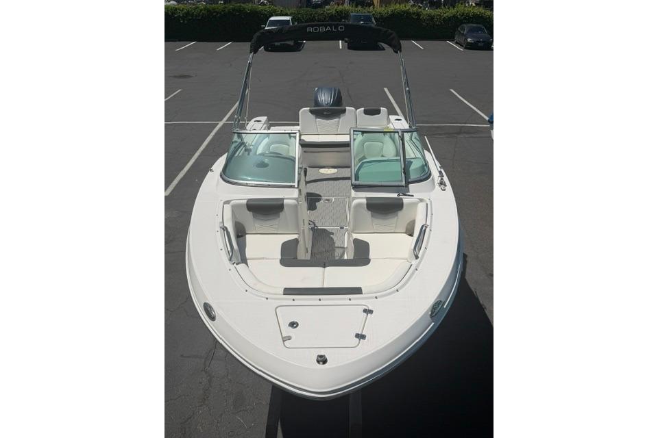 2024 Robalo R207 Dual Console boat in a parking lot, top view.