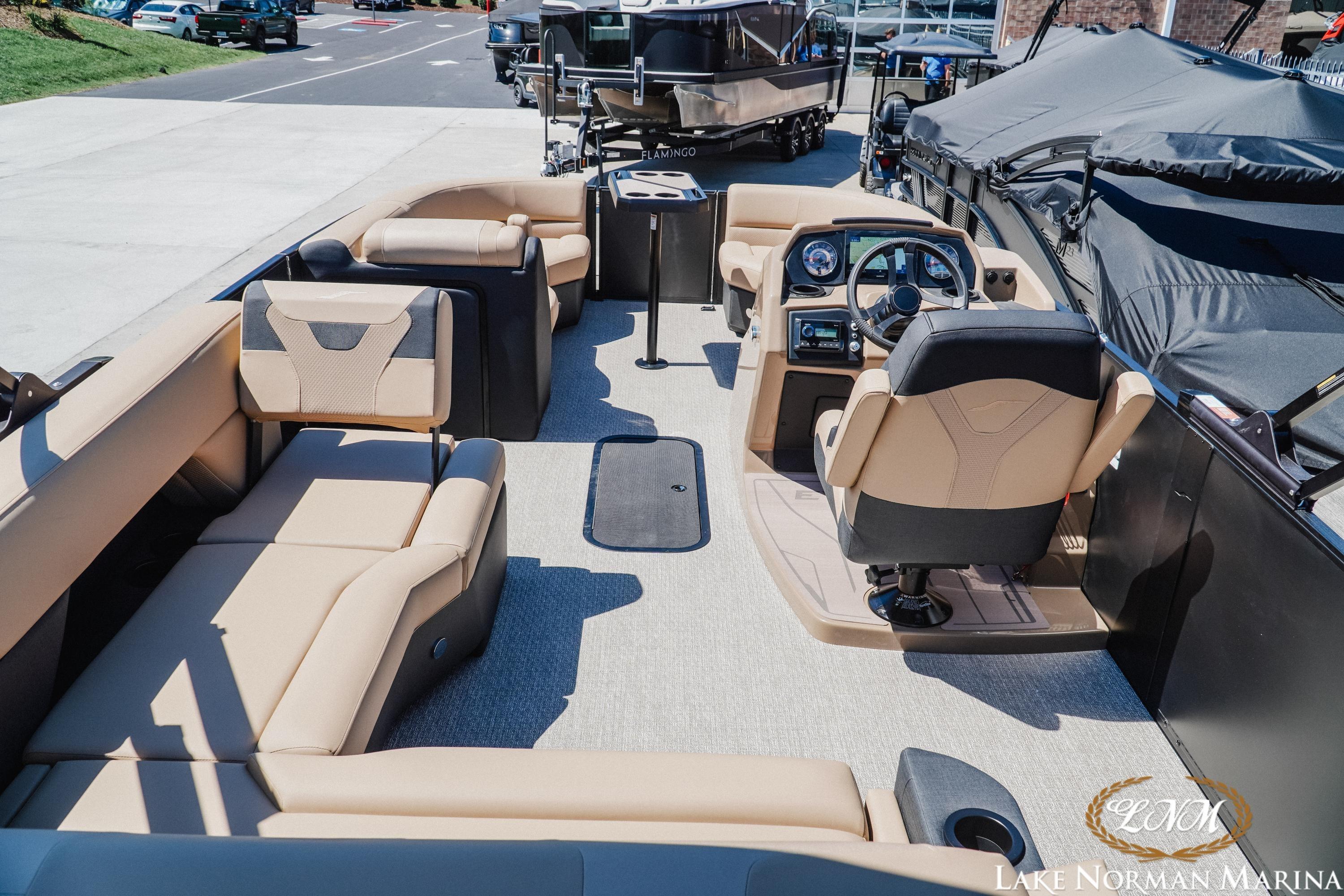 Luxurious 2026 Evotti 523CS pontoon boat interior with plush seating and modern dashboard.