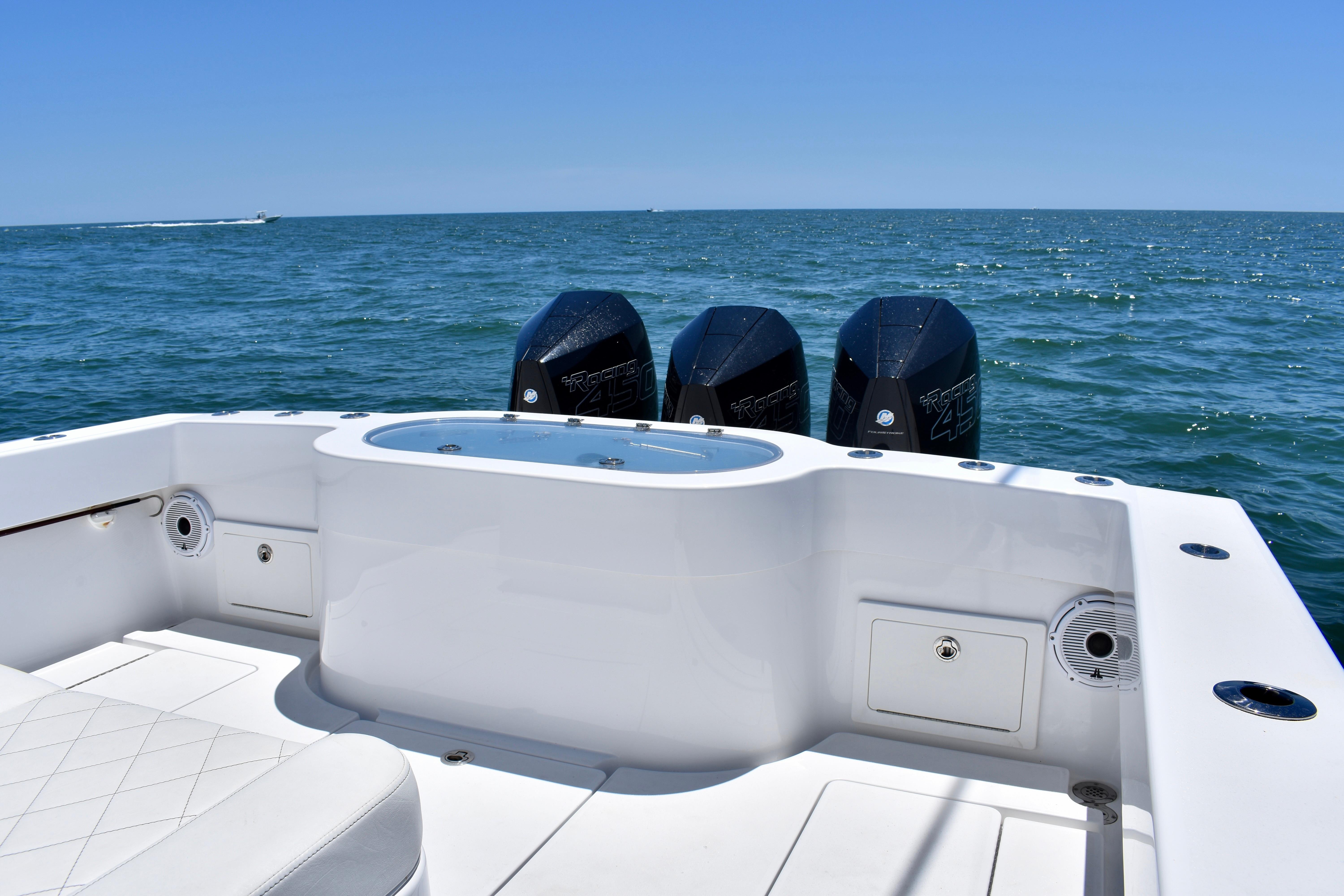 2022 Onslow Bay 41 Tournament boat with triple engines on open sea.