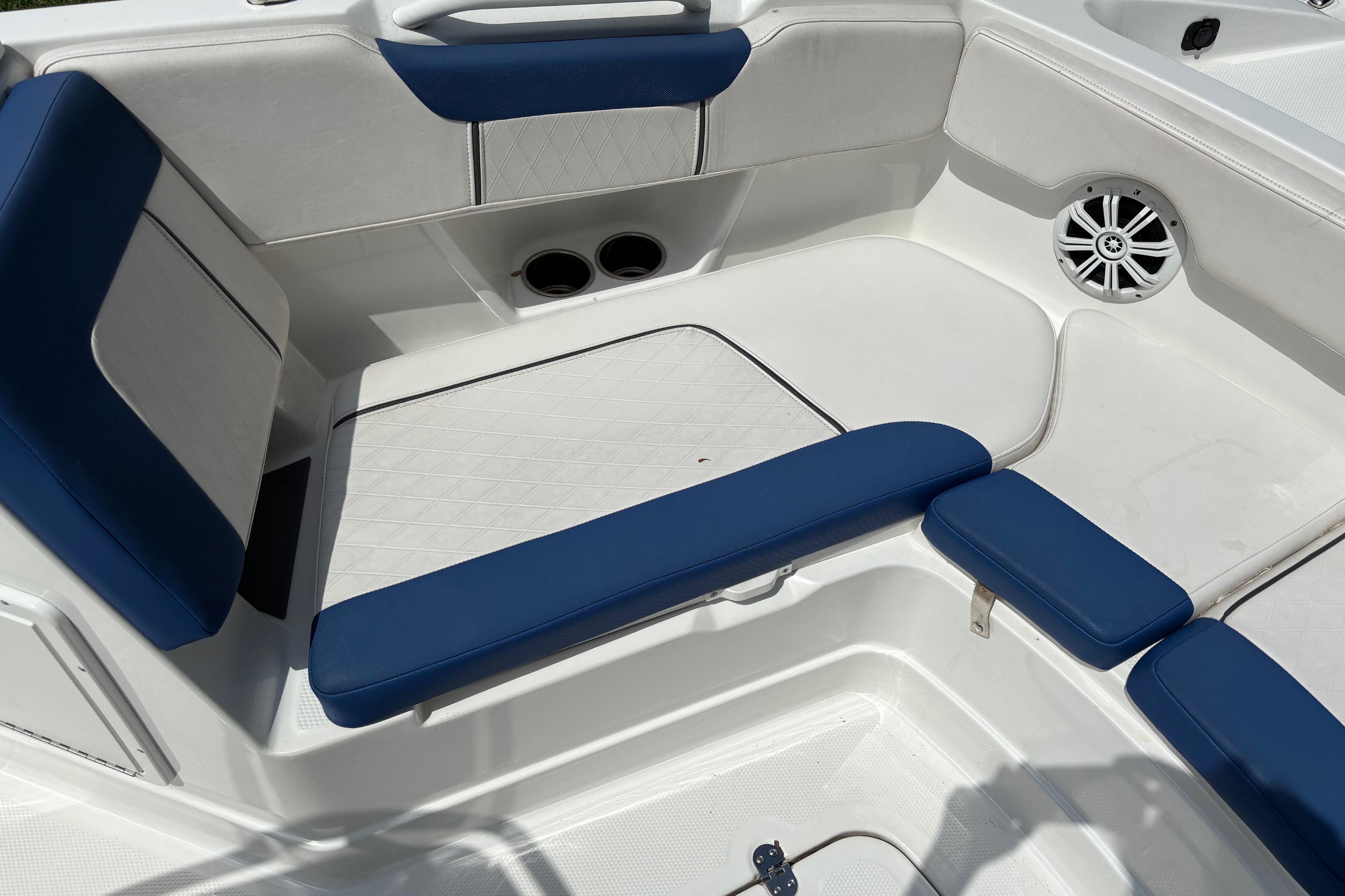 Interior seating of 2020 Tahoe 2150 CC boat with blue and white upholstery.