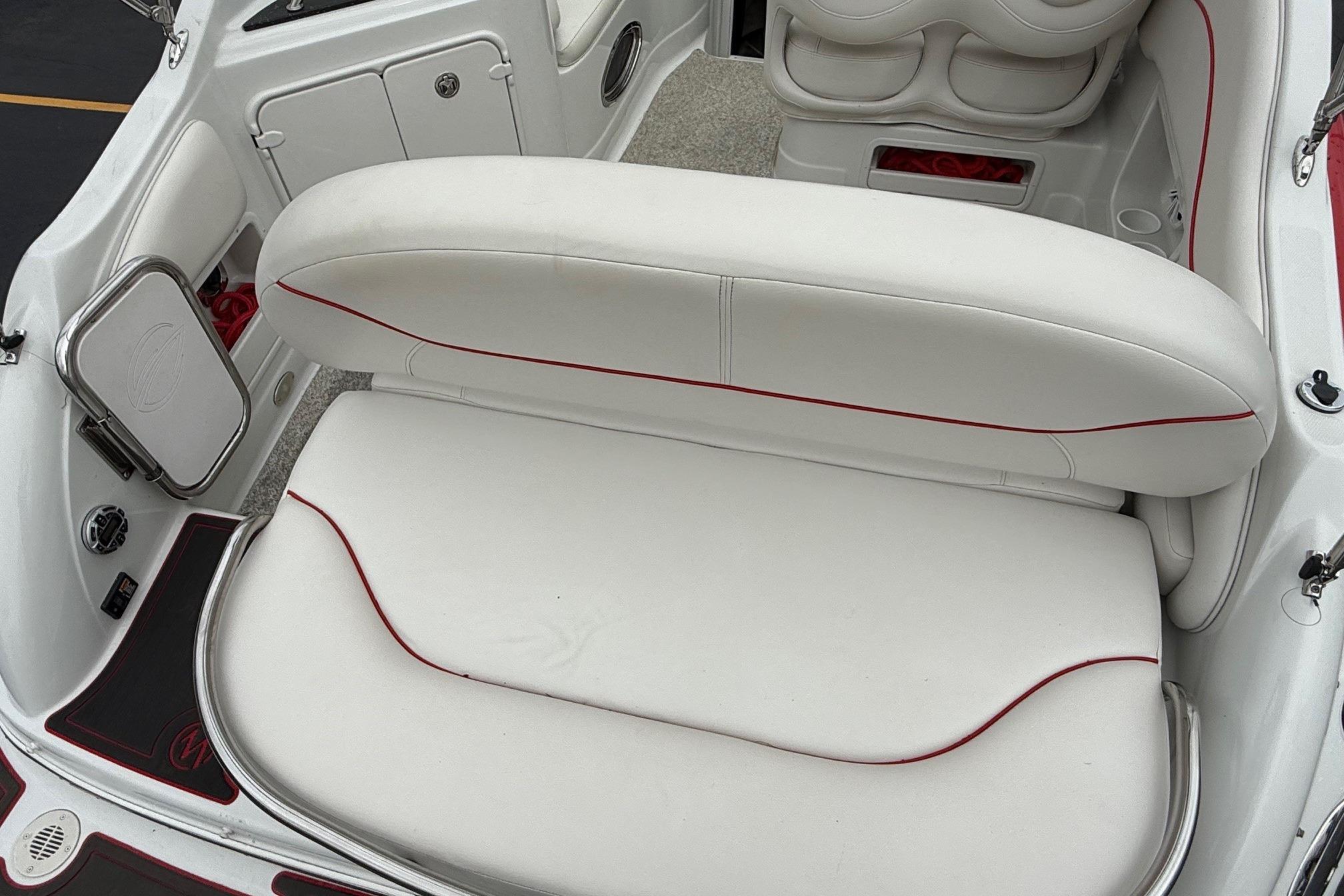 2005 Crownline 250 CR boat interior with white seating and red accents.